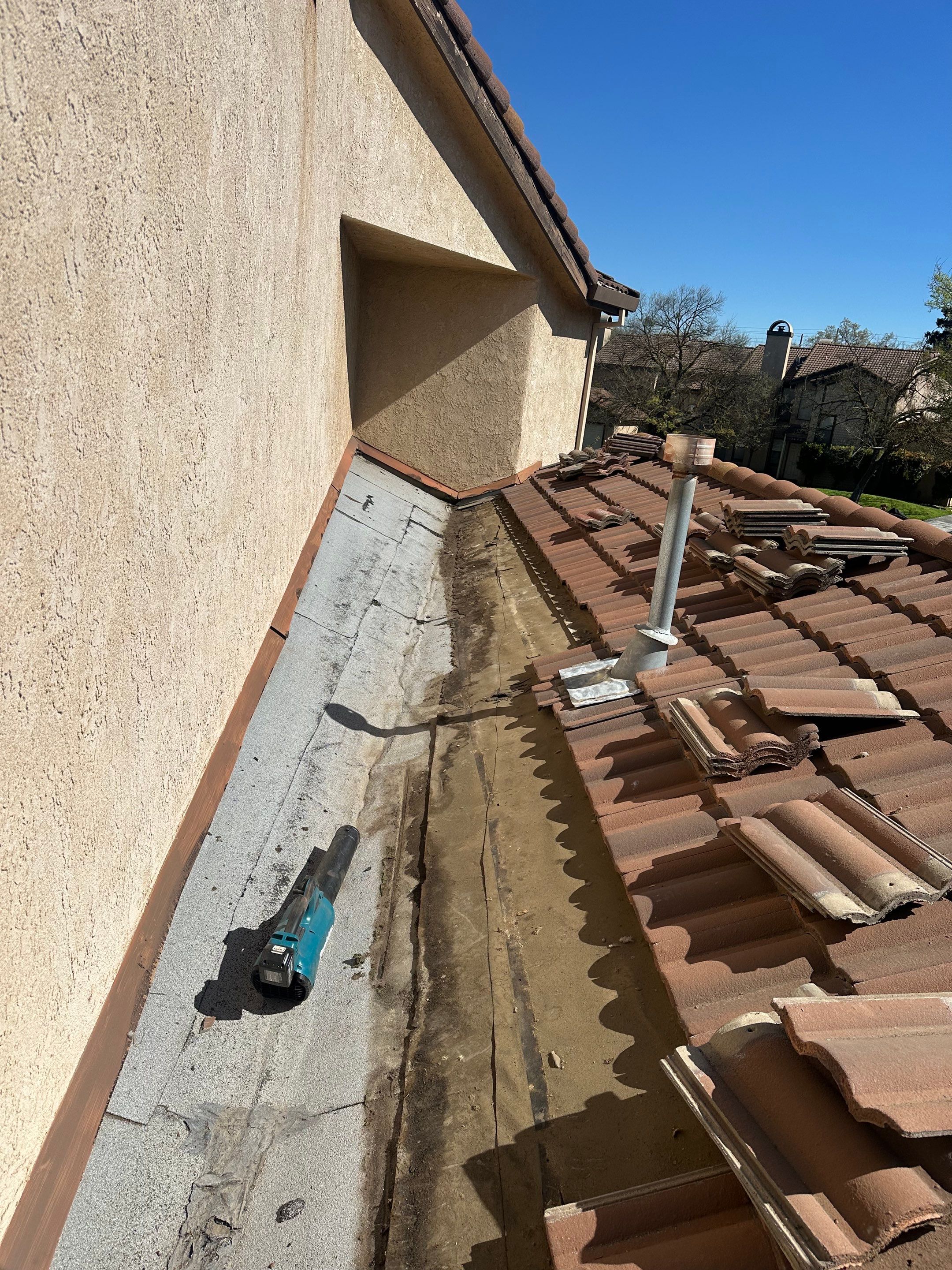 Tile Roof repair by Grandmark Service Company