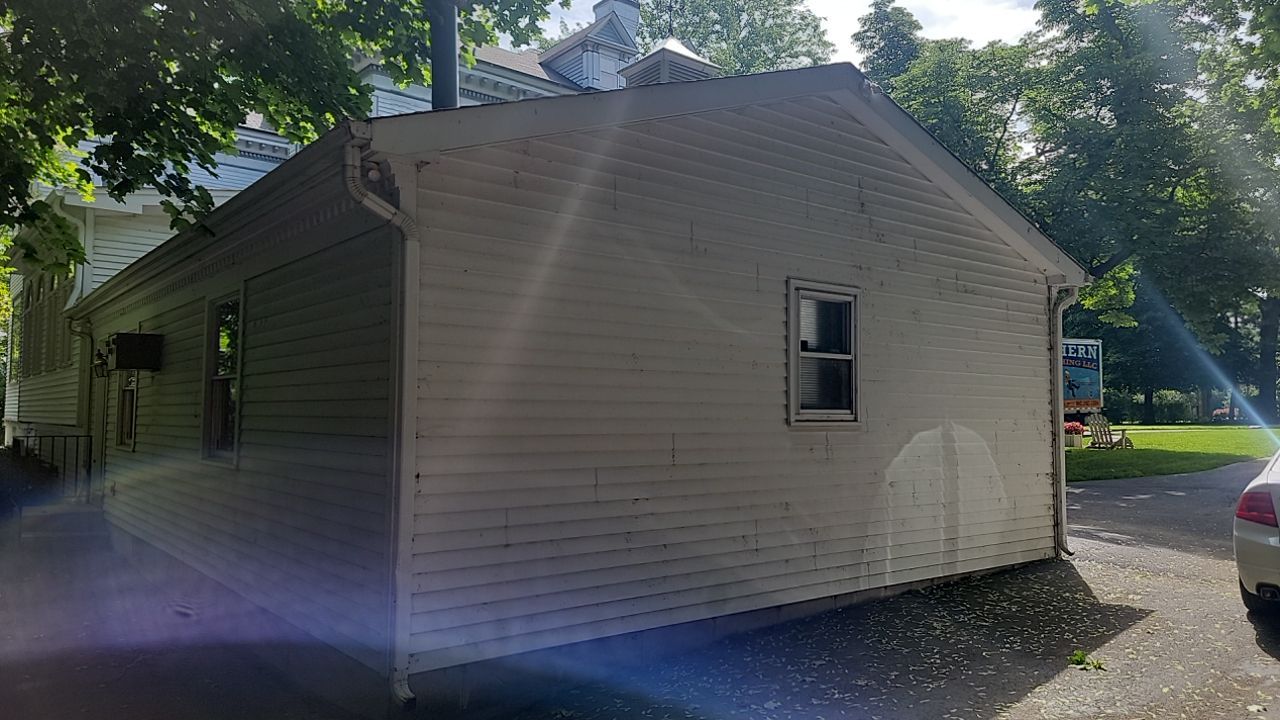 Housewashing  using Algaecide, soft wash soap by Northern Power Washing LLC.