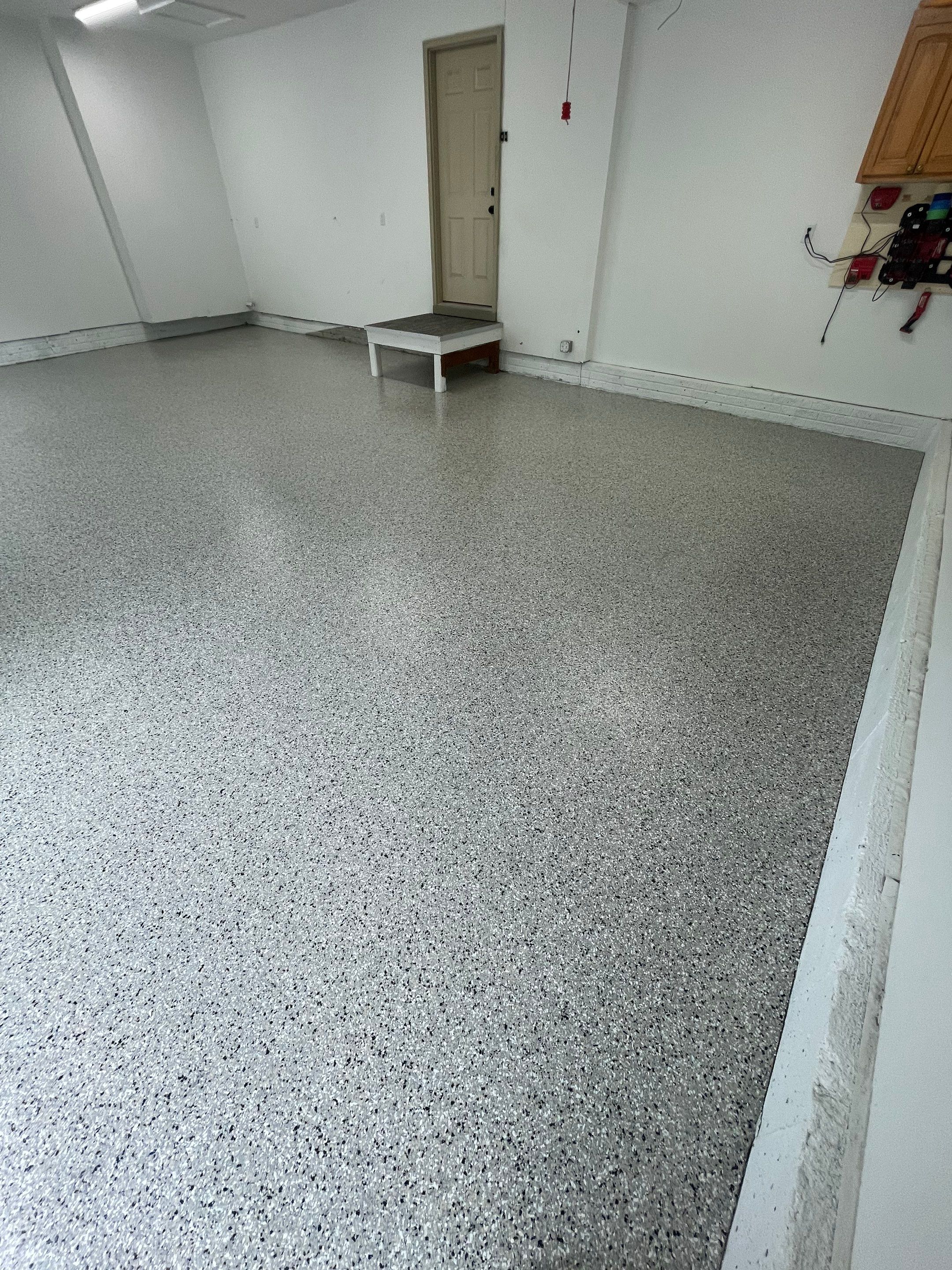 Cabin Fever Garage Floor System in Sioux Falls by Select Painting, Coatings & Garage Cabinets