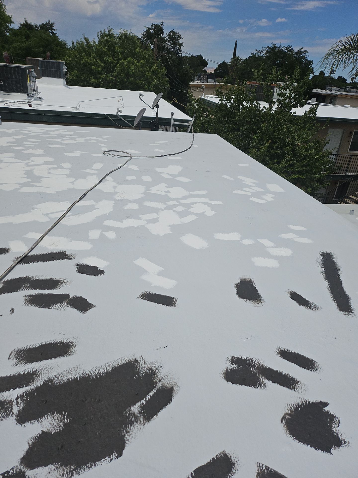 Foam Refurbish using General Coatings acrylic coatings and spray foam by Straight Edge Roofing Inc