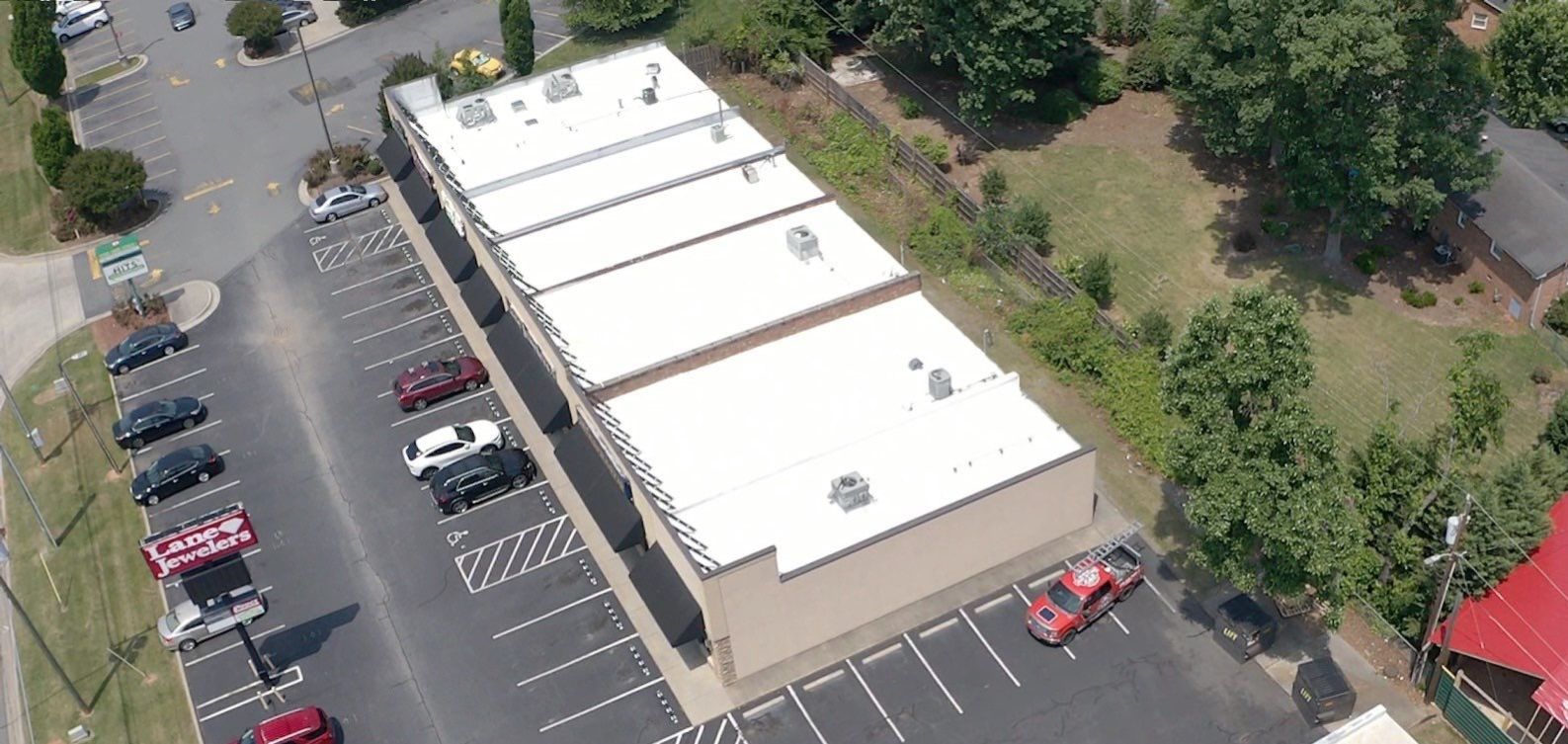 Commercial Roof Coating using Fiberseal basecoat and Silicon Topcoat by Just In Time Roofing and Restoration