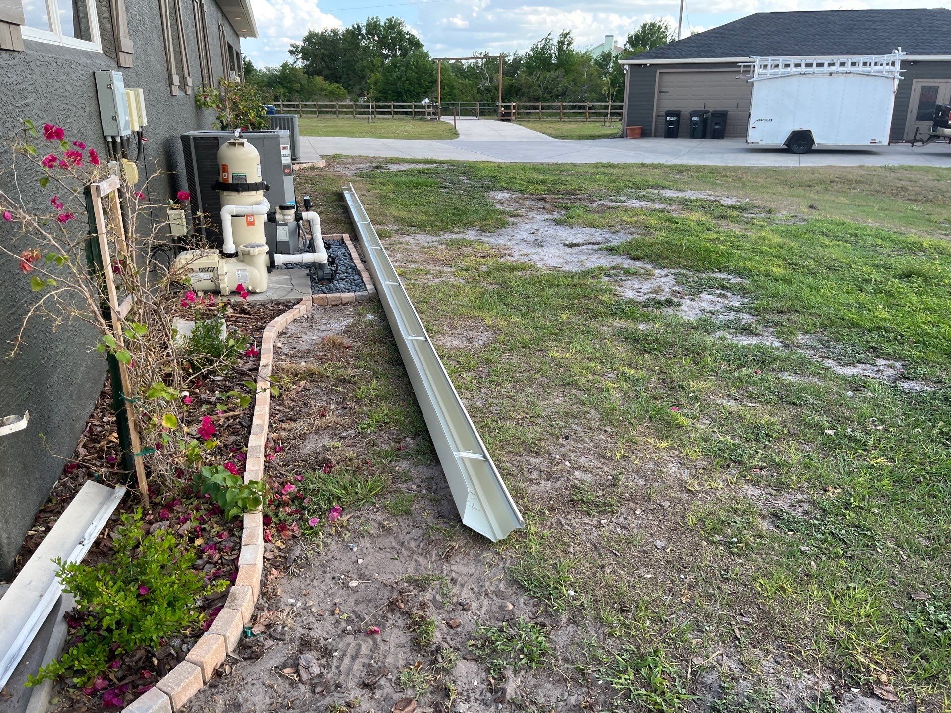 7-inch White seamless gutters and downspouts in Myakka City FL by Gutter Professors