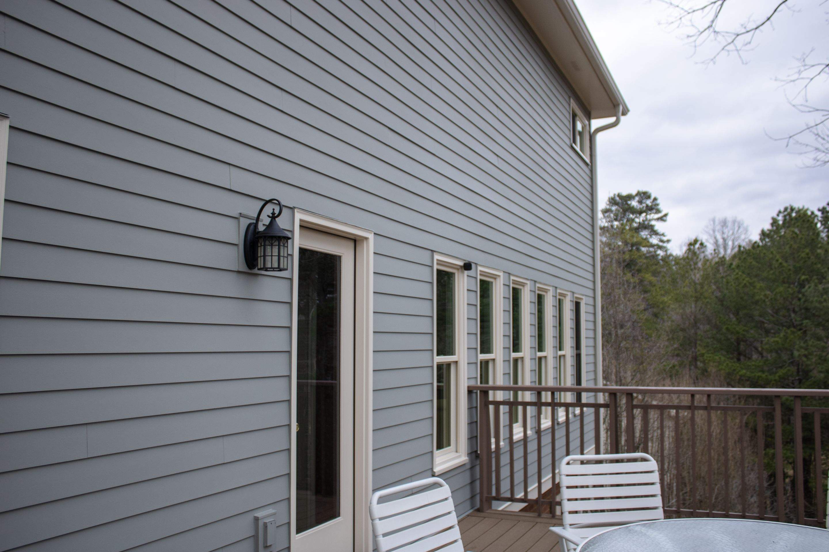 James Hardie Siding Replacement, Exterior Painting, Deck Stain, and Gutter Installation in Peachtree Corners, GA by Nelson Exteriors