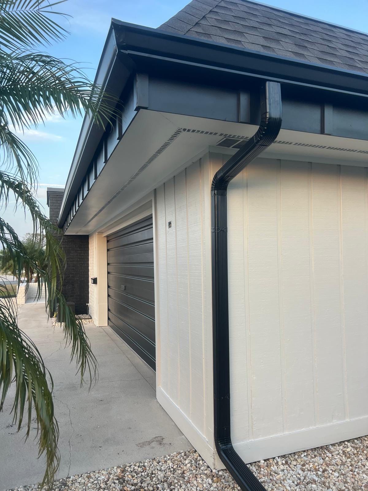 Black 6'' Seamless Gutters K-Style and Black Downspouts in Sun City Center FL by Gutter Professors