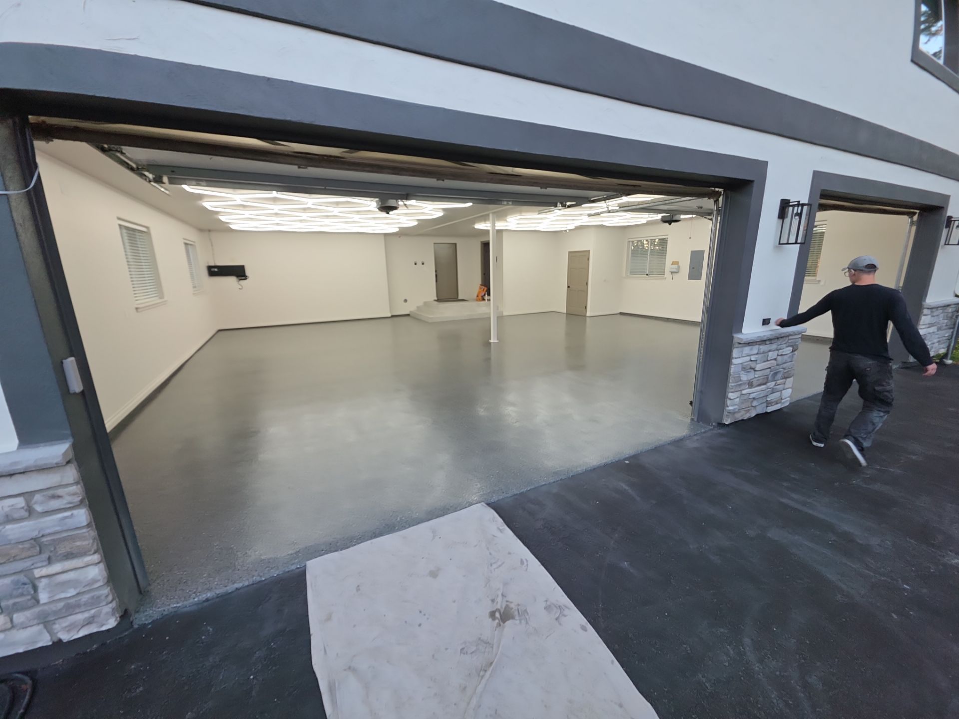 Custom Garage Transformation with Polyaspartic Coating and Hexagonal LED Lighting by Croc Coatings, LLC