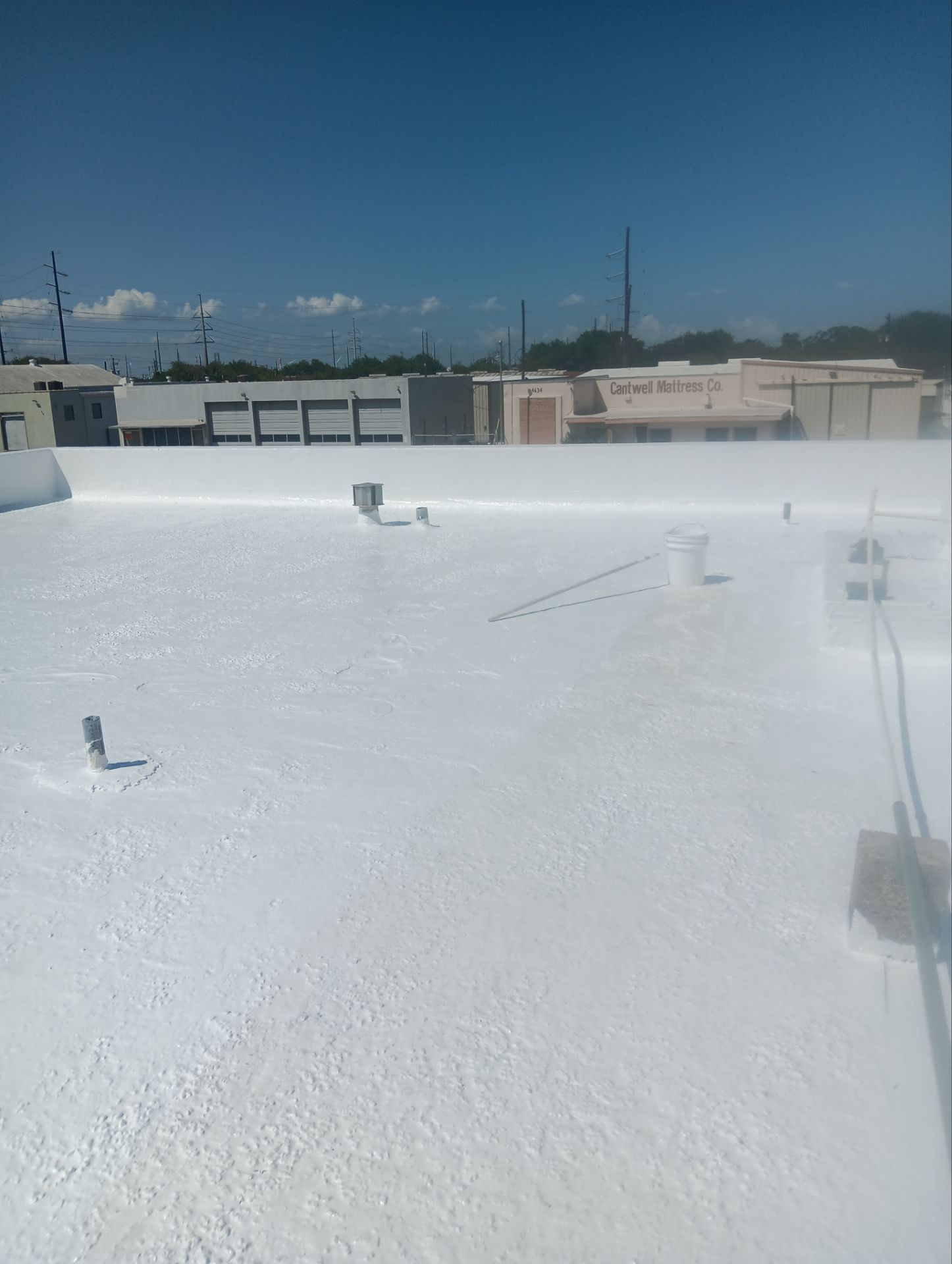 Dirty leaking Gravel Roof by Bayfront Roofing and Construction