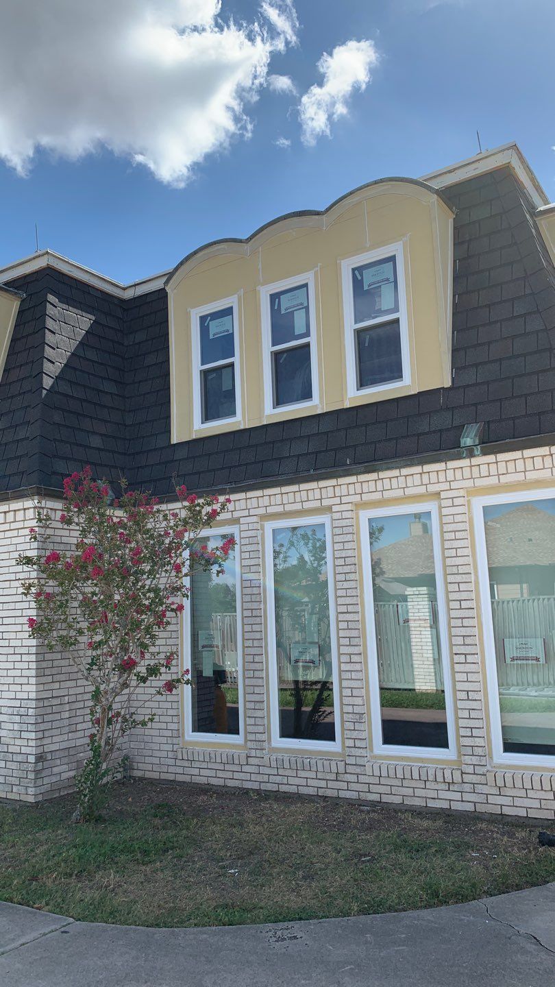 Mansard Charm by Bayfront Roofing and Construction