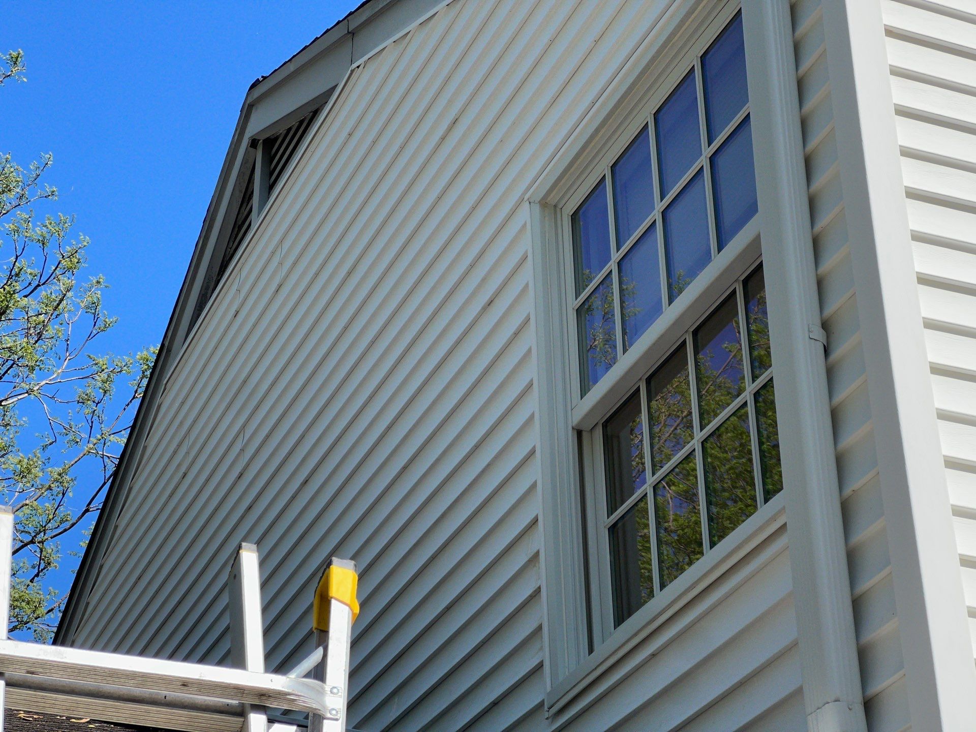Housewashing  using Algaecide, soft wash soap by Northern Power Washing LLC.