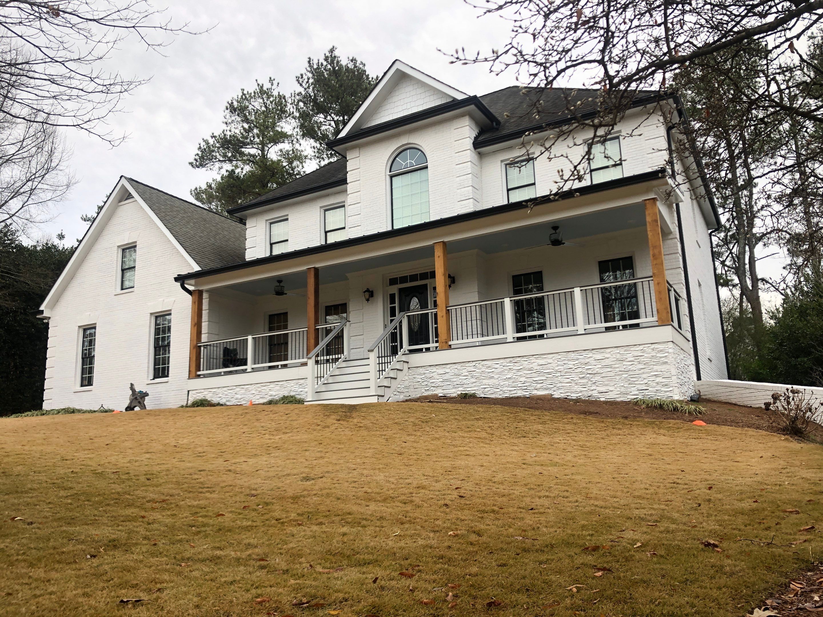 Custom Front Porch Construction with White Railing in Dunwoody by Swift Home Renovations