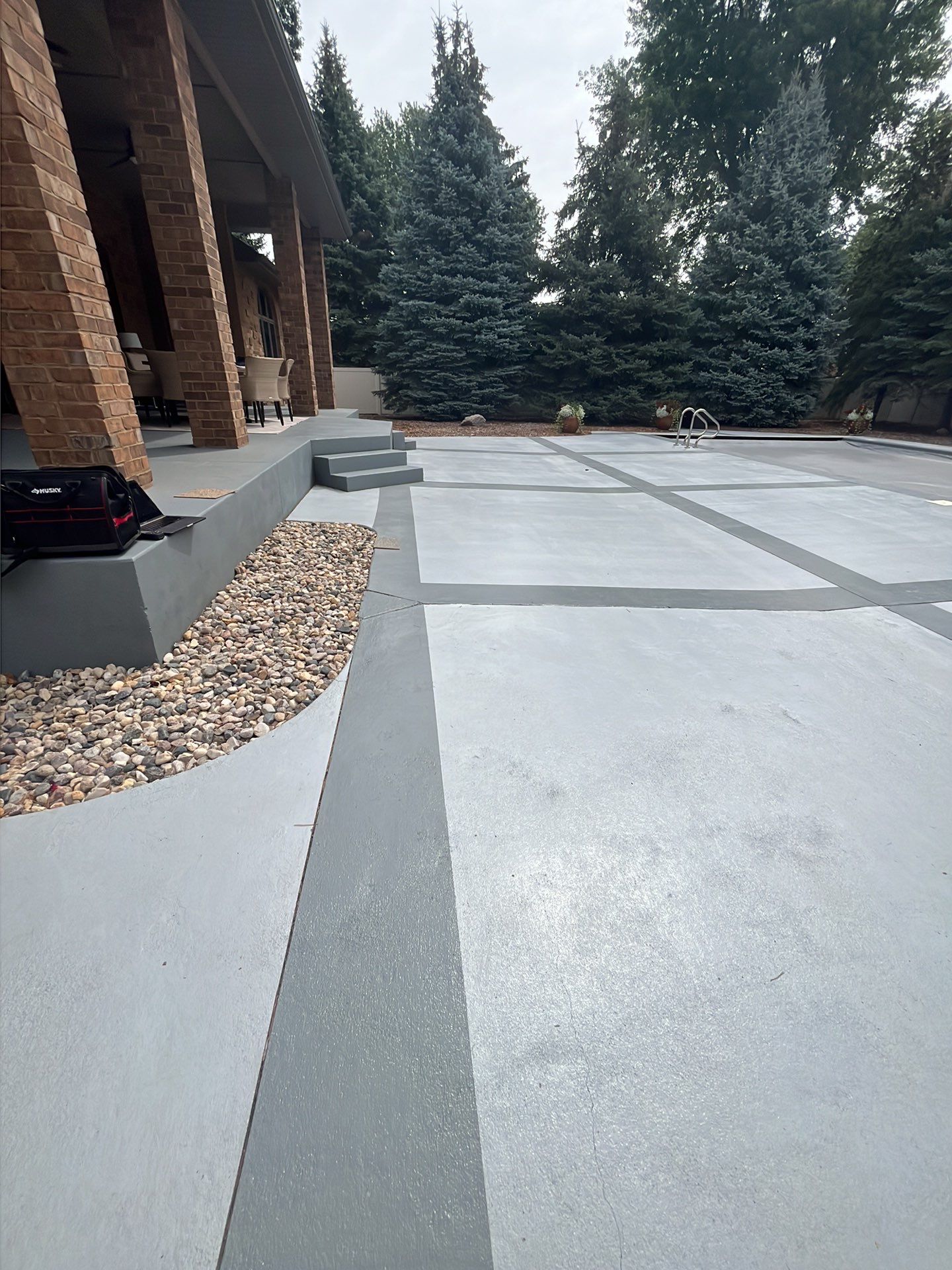 Decorative Concrete Pool Deck and Patio Resurfacing in Sioux Falls by Select Painting, Coatings & Garage Cabinets