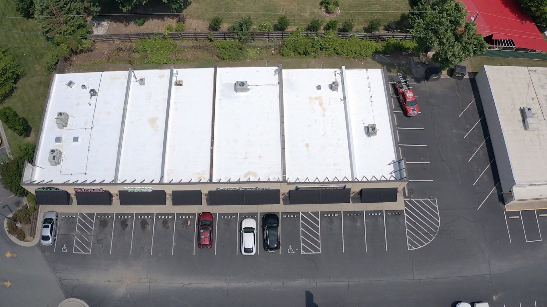 Commercial Roof Coating using Fiberseal basecoat and Silicon Topcoat by Just In Time Roofing and Restoration