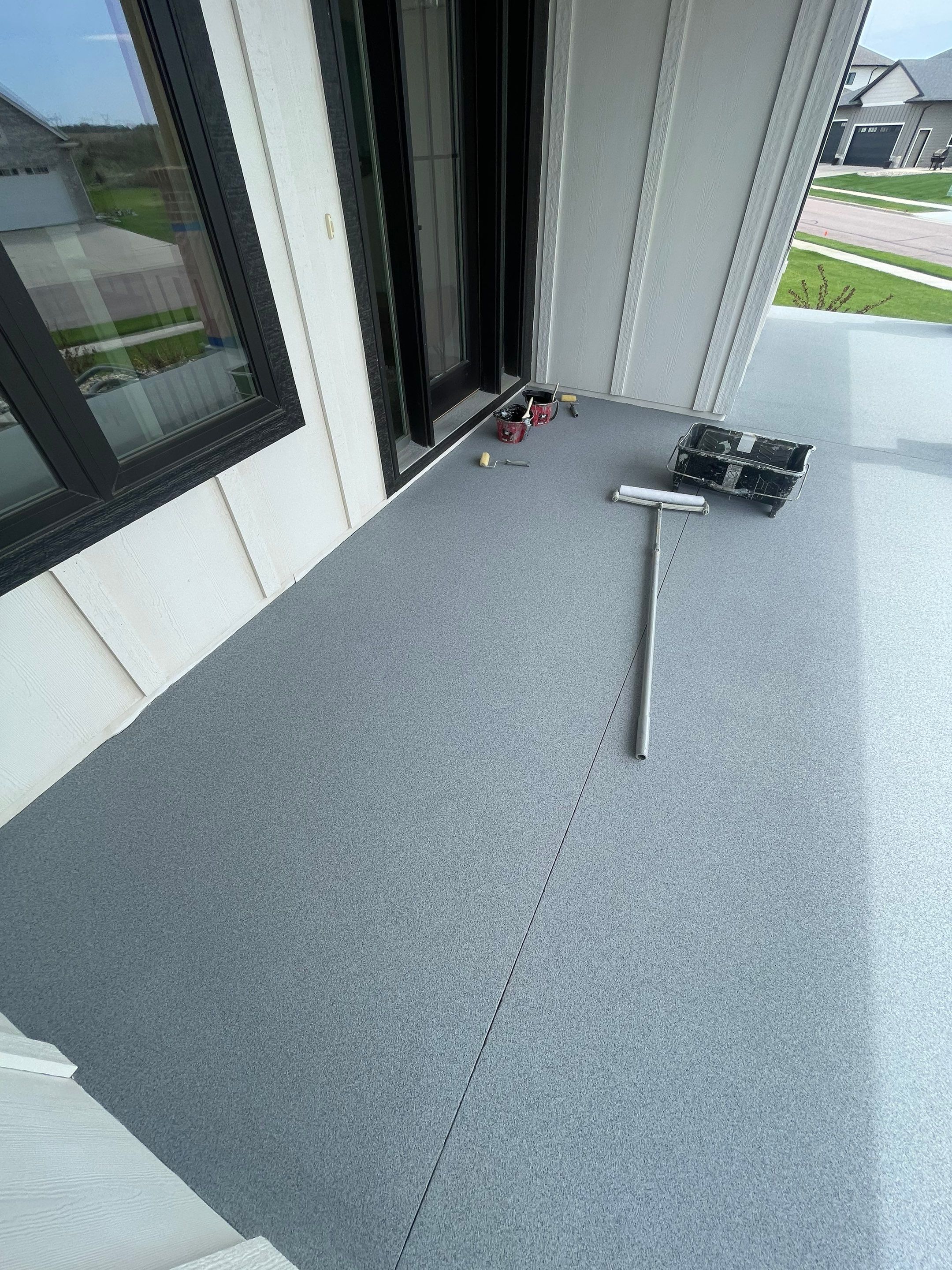 Grey Speckled Concrete Porch Coating for Sioux Falls Home by Select Painting, Coatings & Garage Cabinets