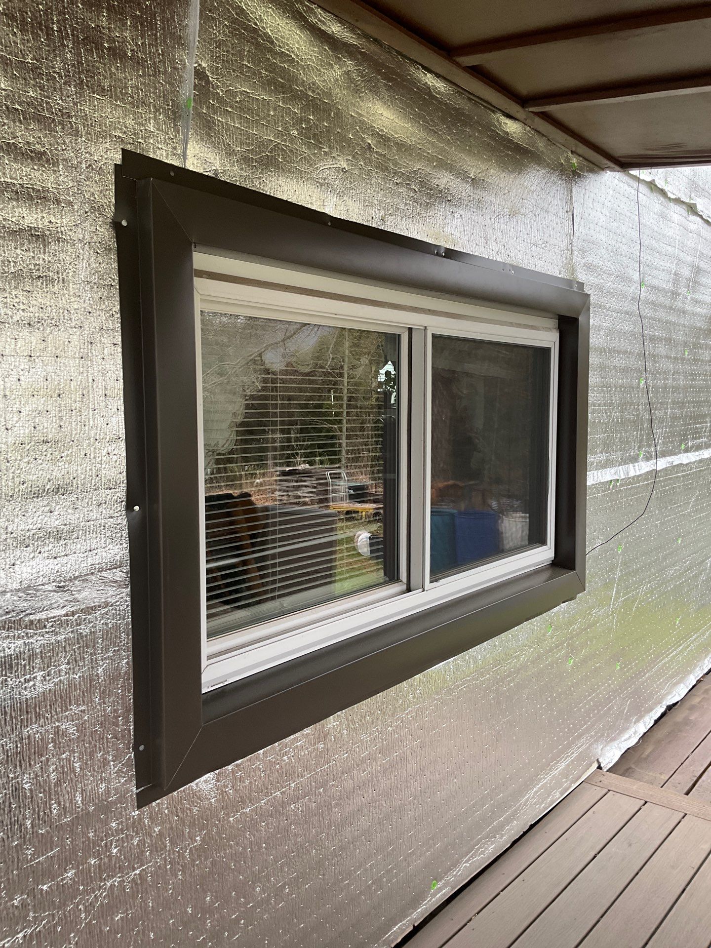 Exterior Renovation with Vinyl Siding, Metal Roof & Spouting  by Esh Builders