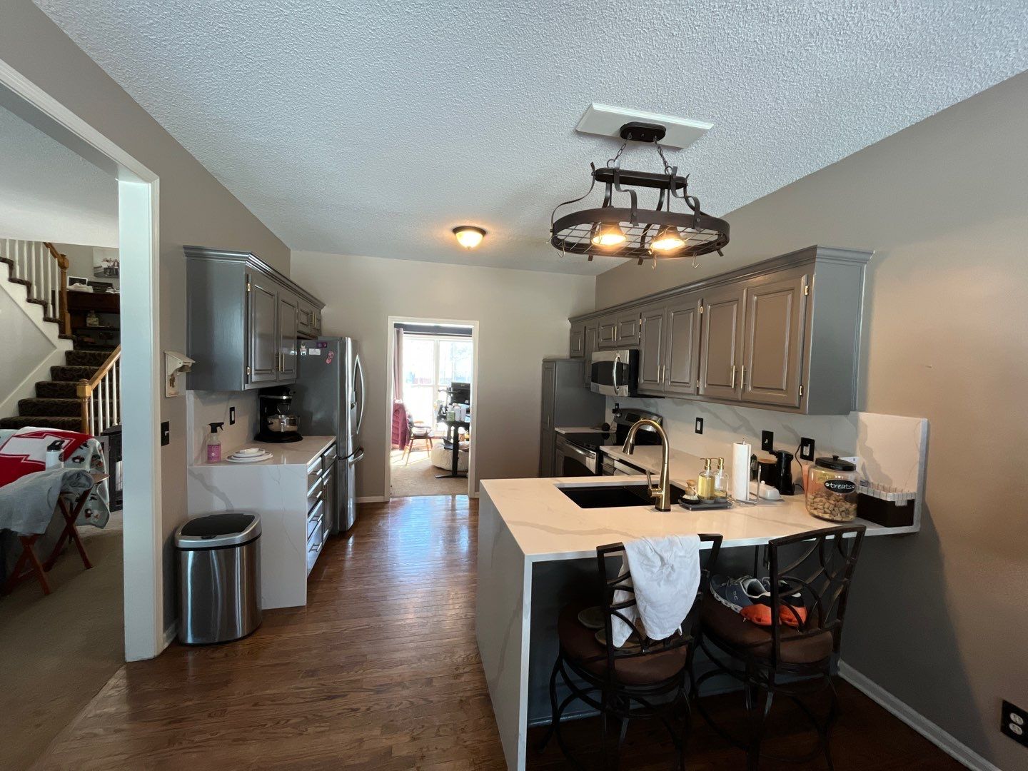 Cabinet Refresh – From Classic White to Modern Gray by Cougar Painting