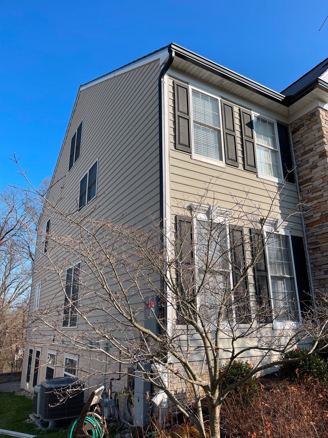 Tesla Solar Roof and Gutter Installation by American Home Contractors