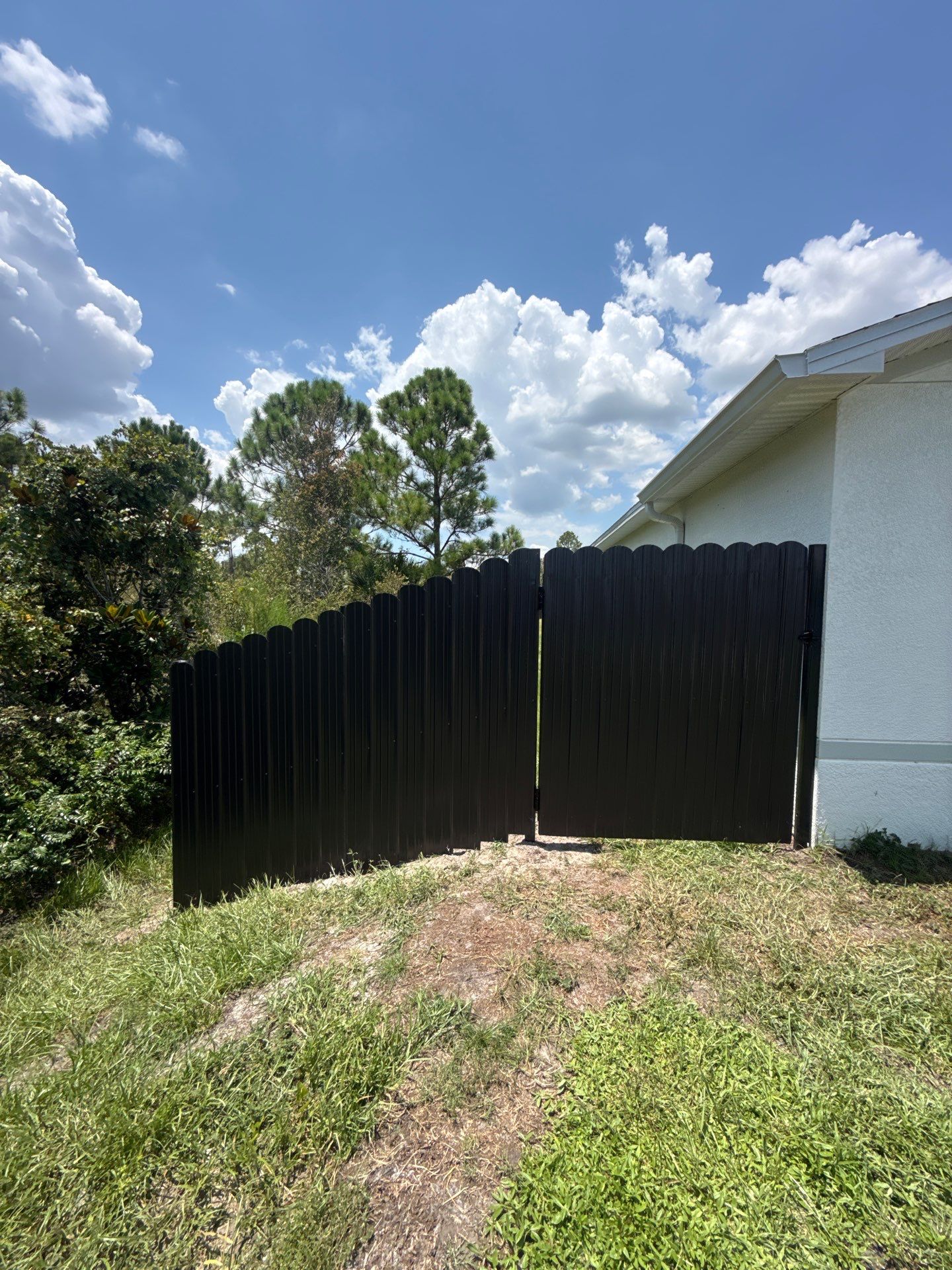 Black Scalloped Metal Privacy Fence Installation in Punta Gorda by True Fence LLC
