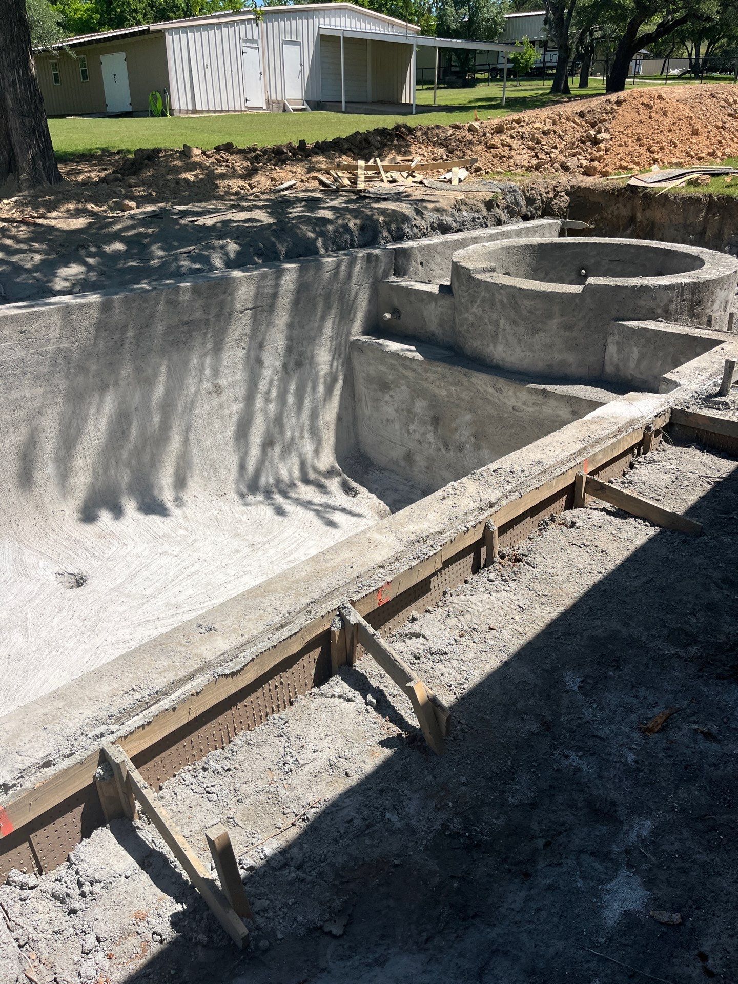 Geometric Pool with Raised Stone Spa by Pinnacle Pools and Spas - DFW