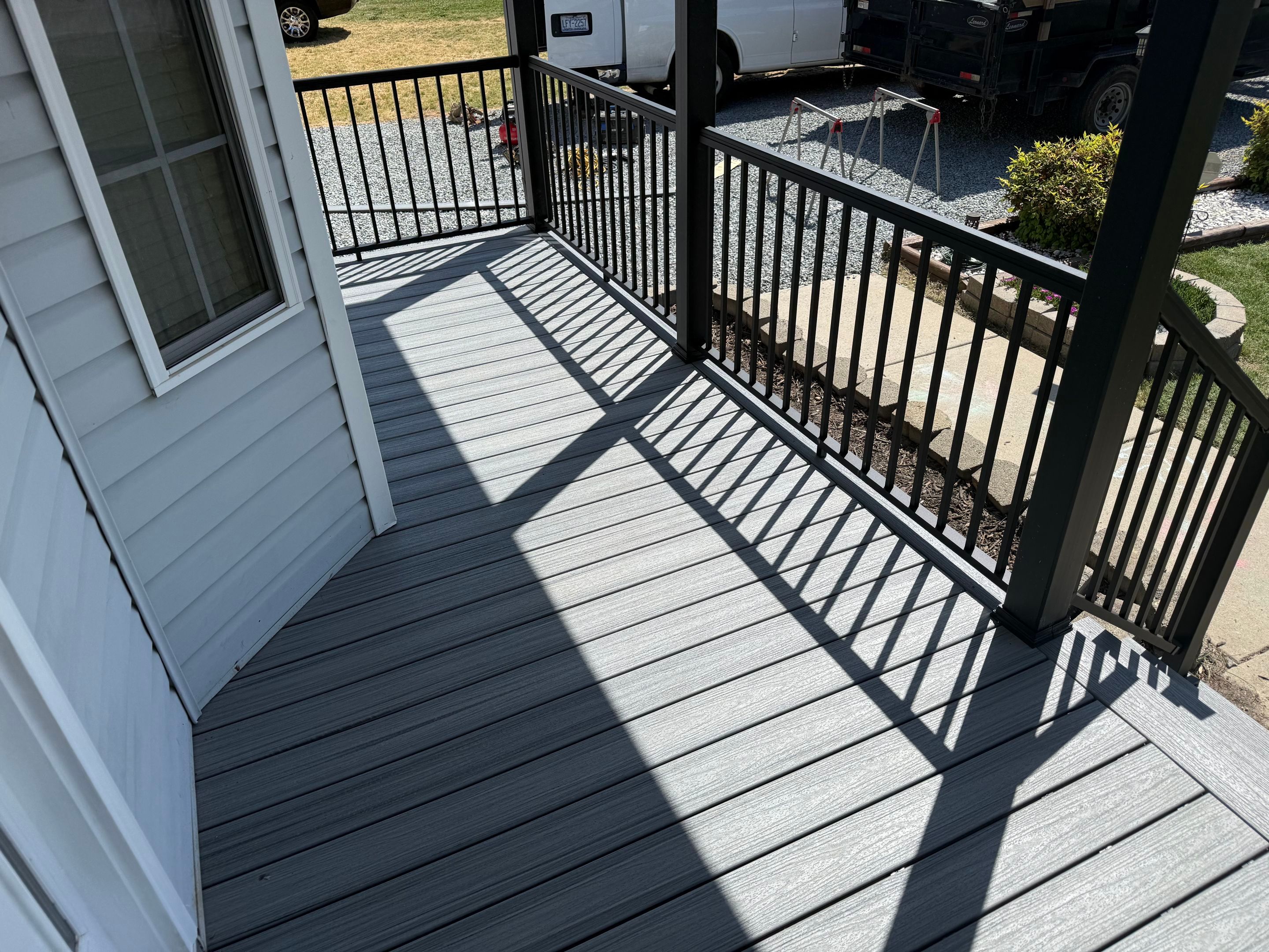Willow Spring Composite Deck Resurface and Black Railing Upgrade by The Remodeling Company