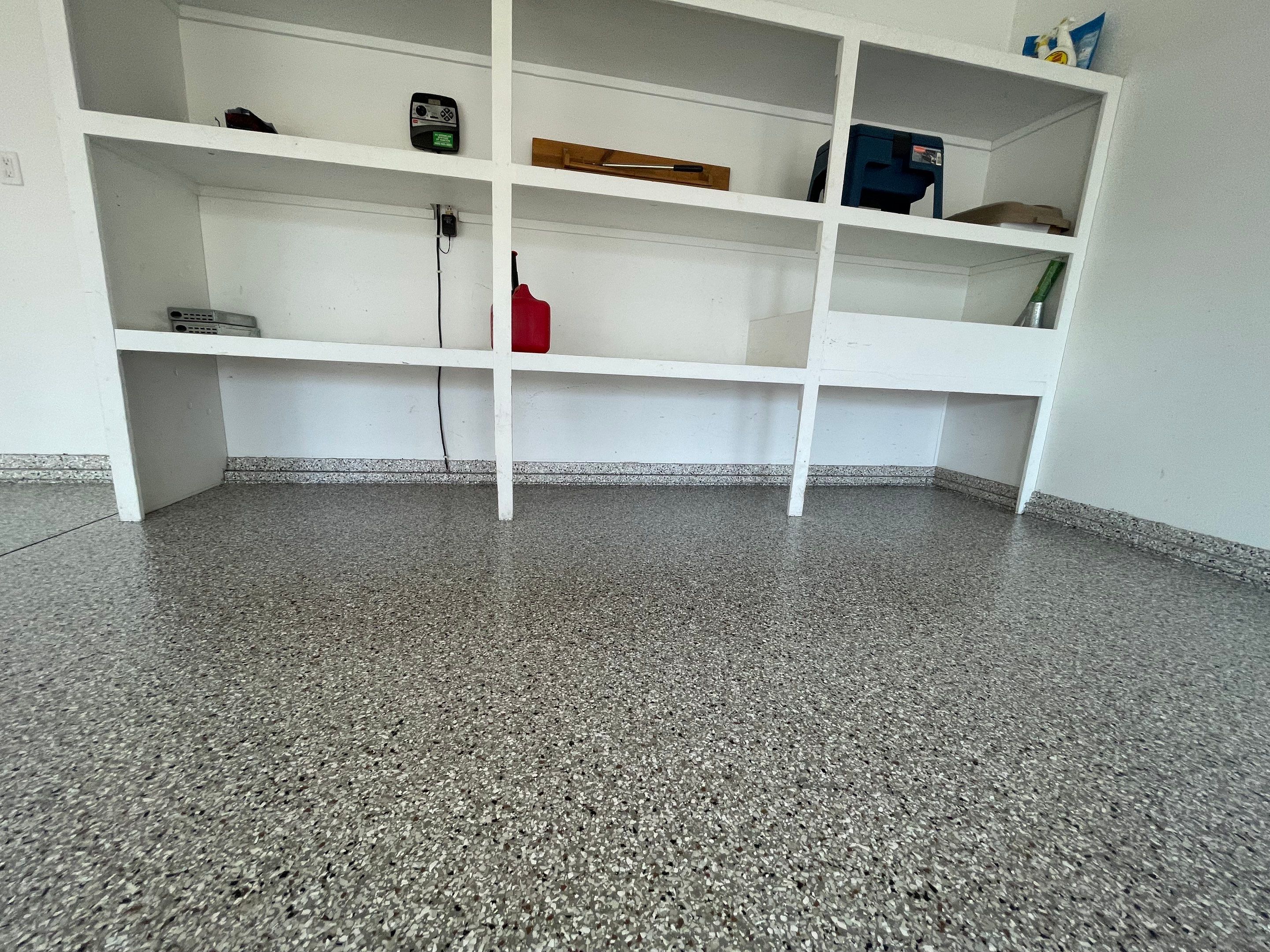Yankton Garage Floor Restoration with Gray Speckled Epoxy Coating by Select Painting, Coatings & Garage Cabinets