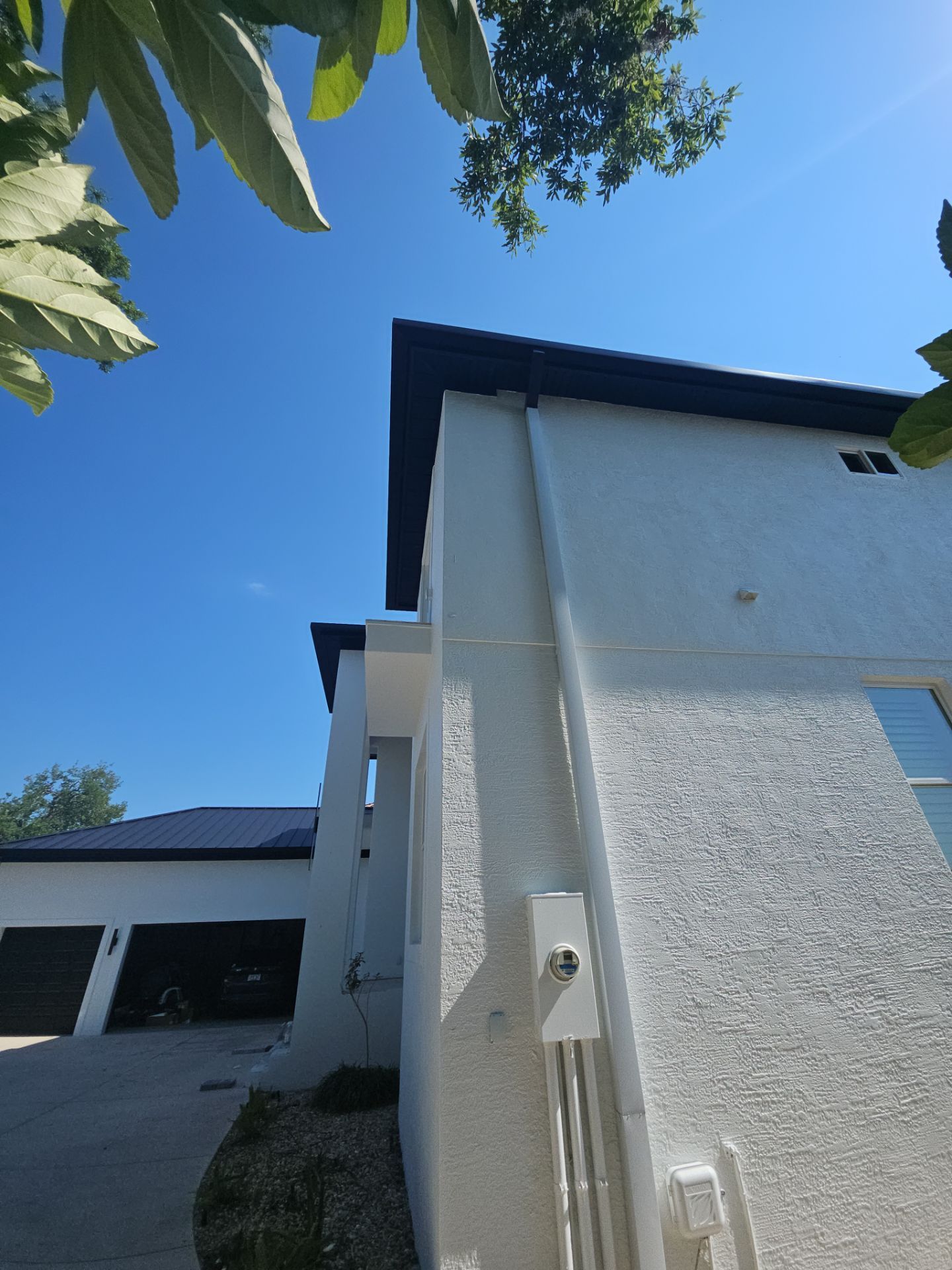 Soffit and Fascia Installation and black seamless gutters in Sarasota FL by Gutter Professors