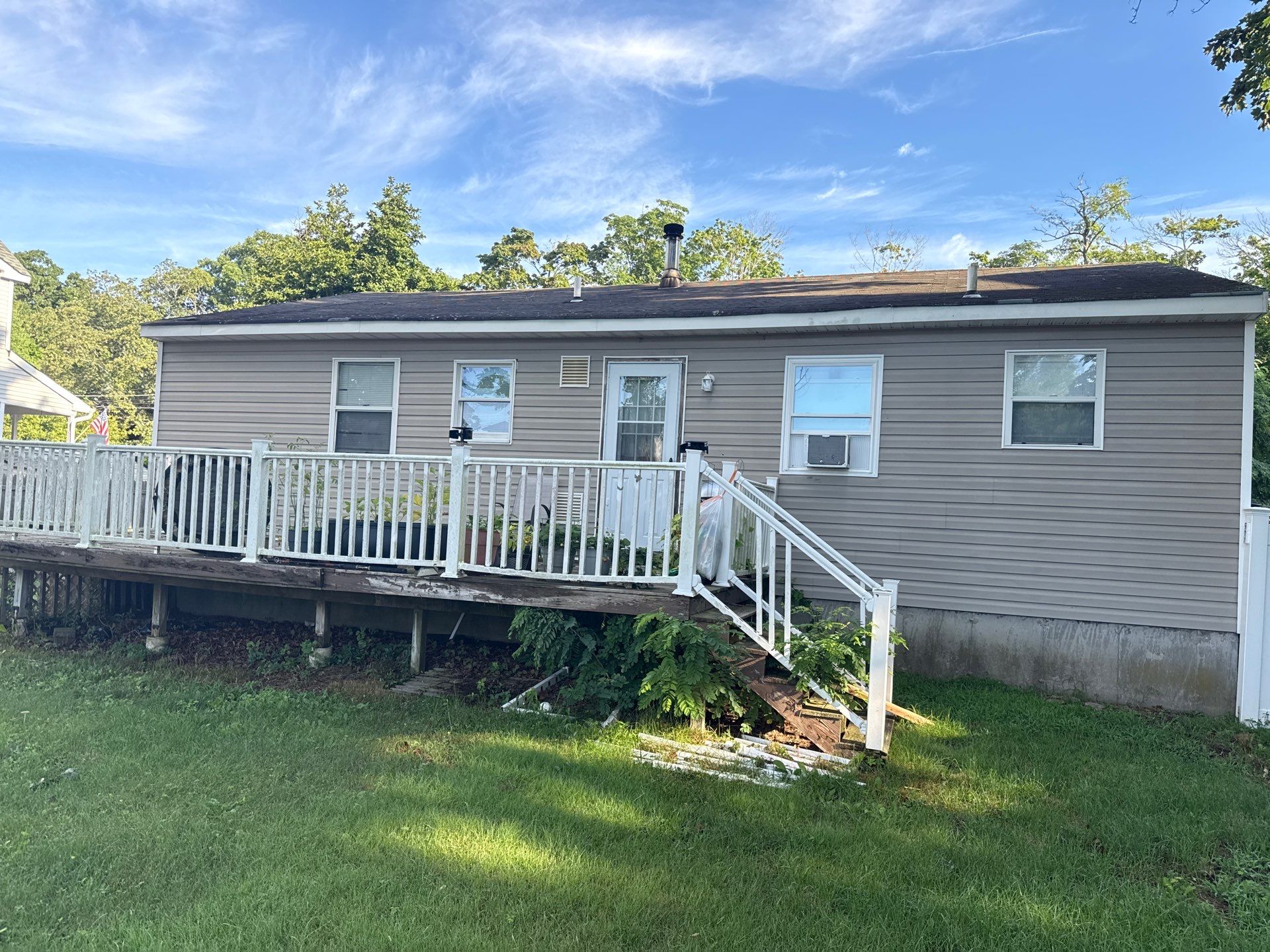 Asphalt Shingle Roof Replacement for Mastic Beach Residence by Smart Choice Contracting