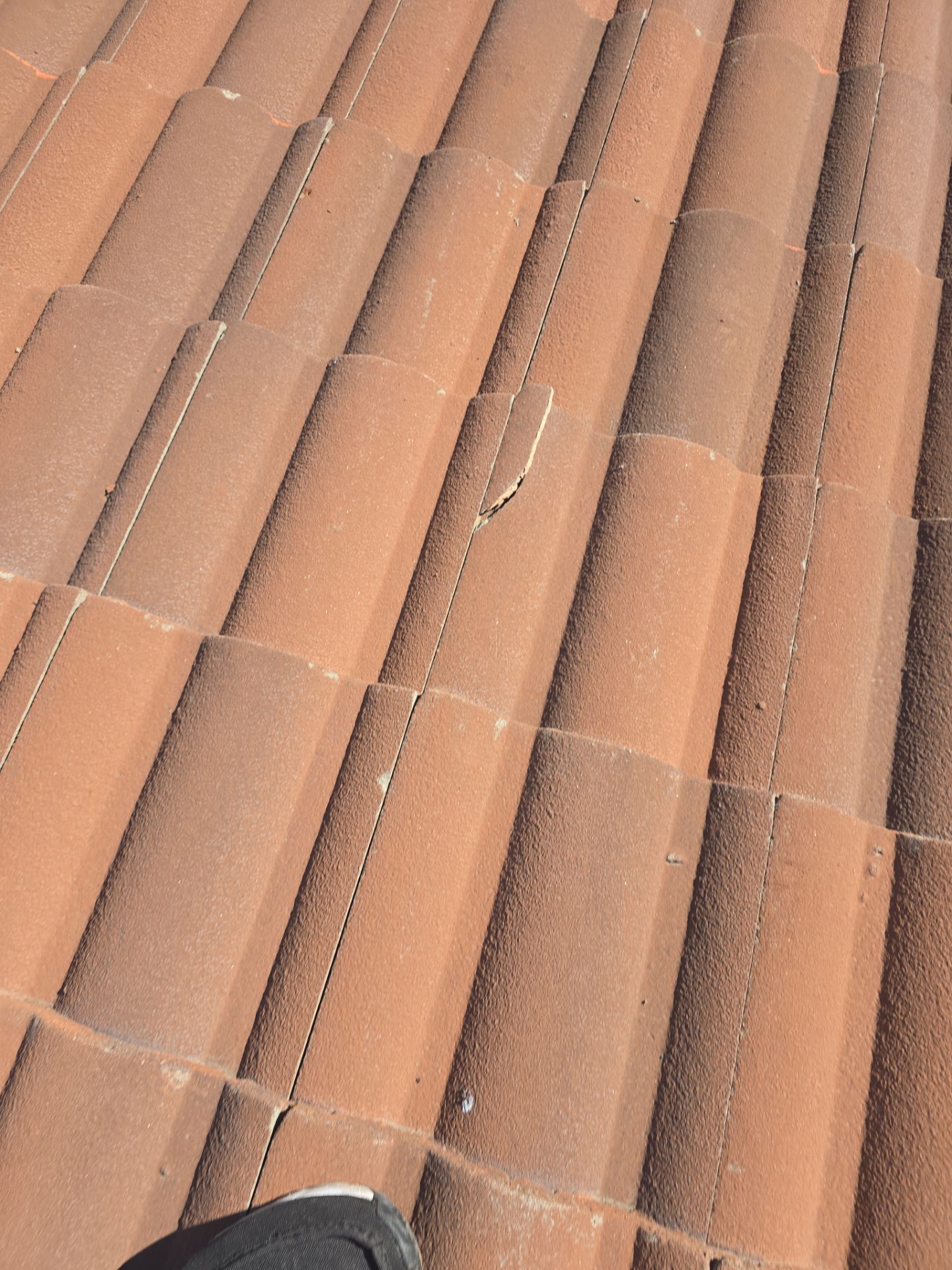 Tile Roof repair by Grandmark Service Company
