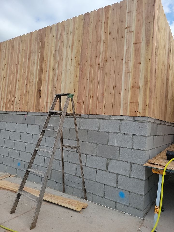Cedar Fence using Cedar Pickets and Metal Poles by Clays Services Inc