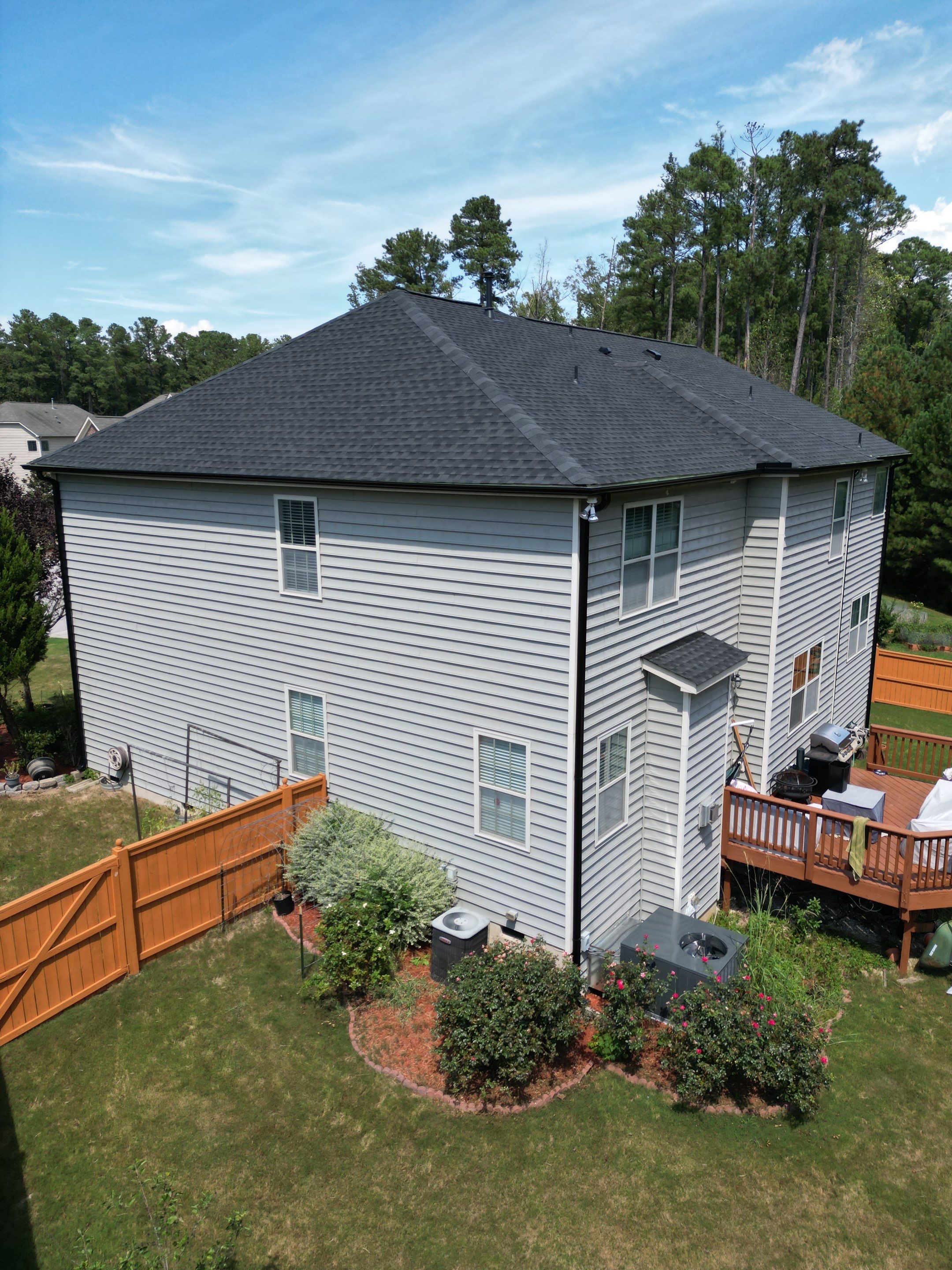 Roof Replacment - GAF Timberline HDZ Charcoal with 5” black seamless gutters  by Pro Performance Roofing