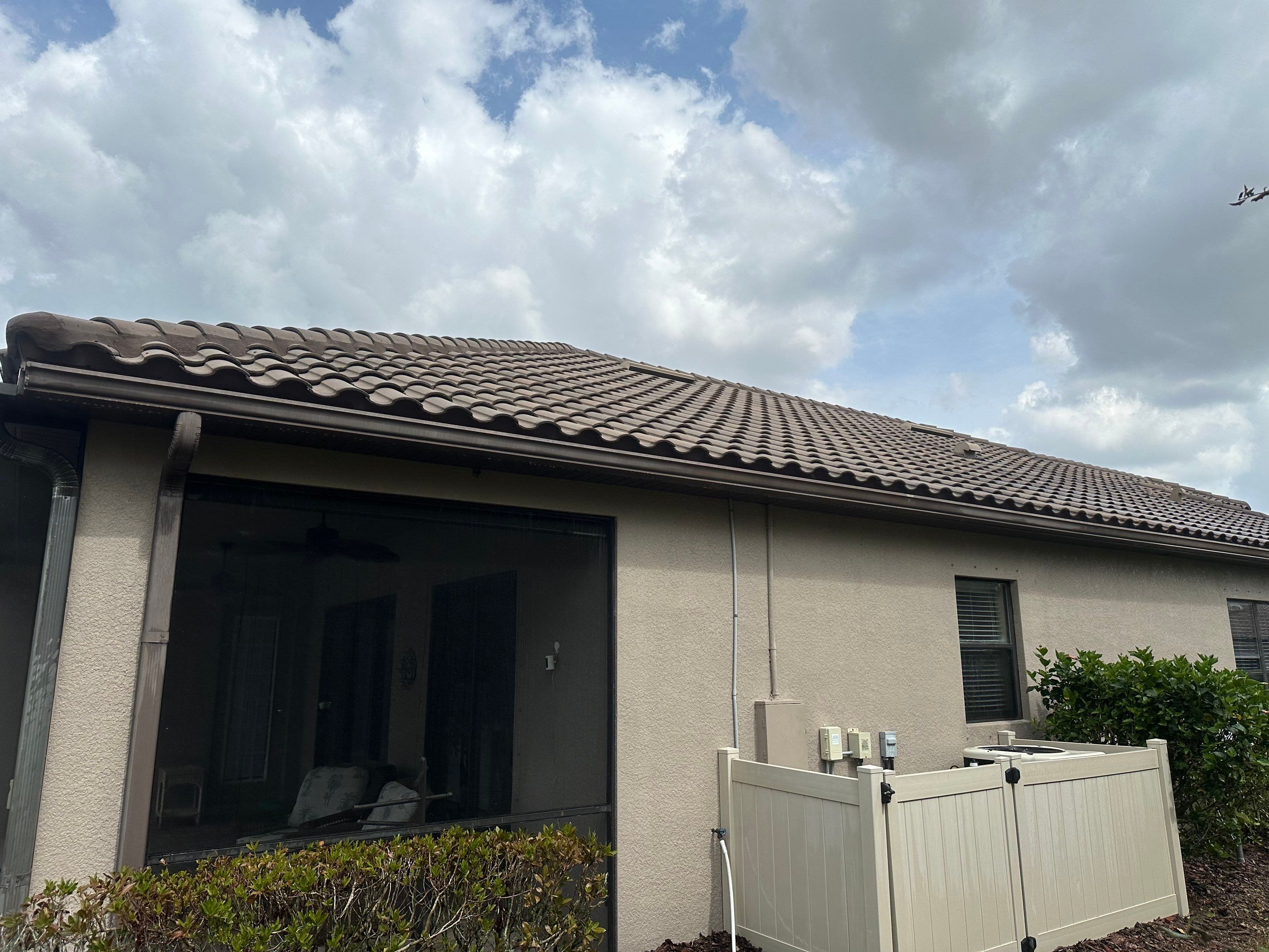 Concrete Tile Roof, Paver Pool Deck, Screen Enclosure & Driveway Cleaning in Artisan Lakes Esplanade, Palmetto, FL | Sunshine AquaWash by Sunshine AquaWash