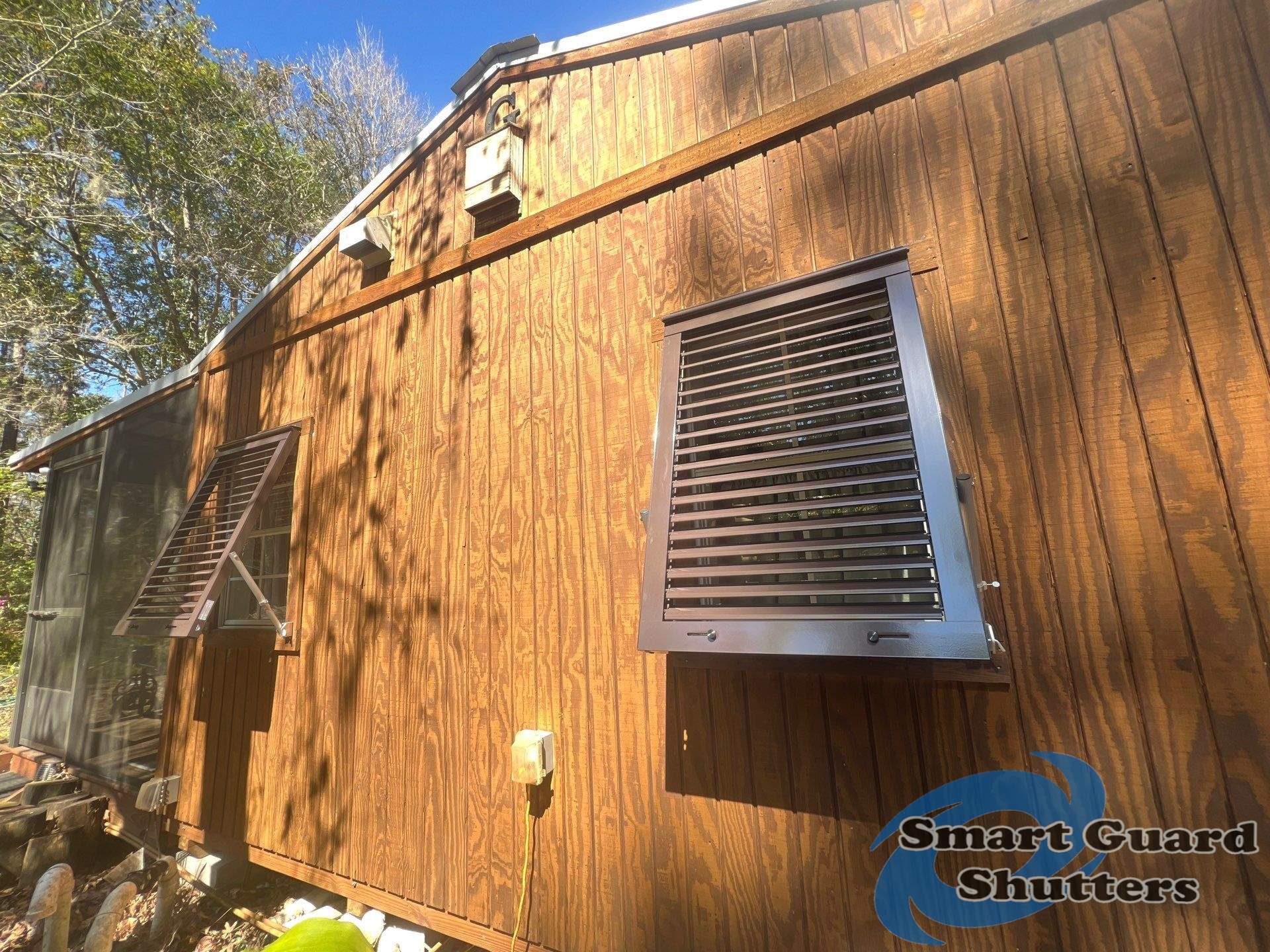 Hurricane Protection in Bronze/Grey Brown by Smart Guard Shutters