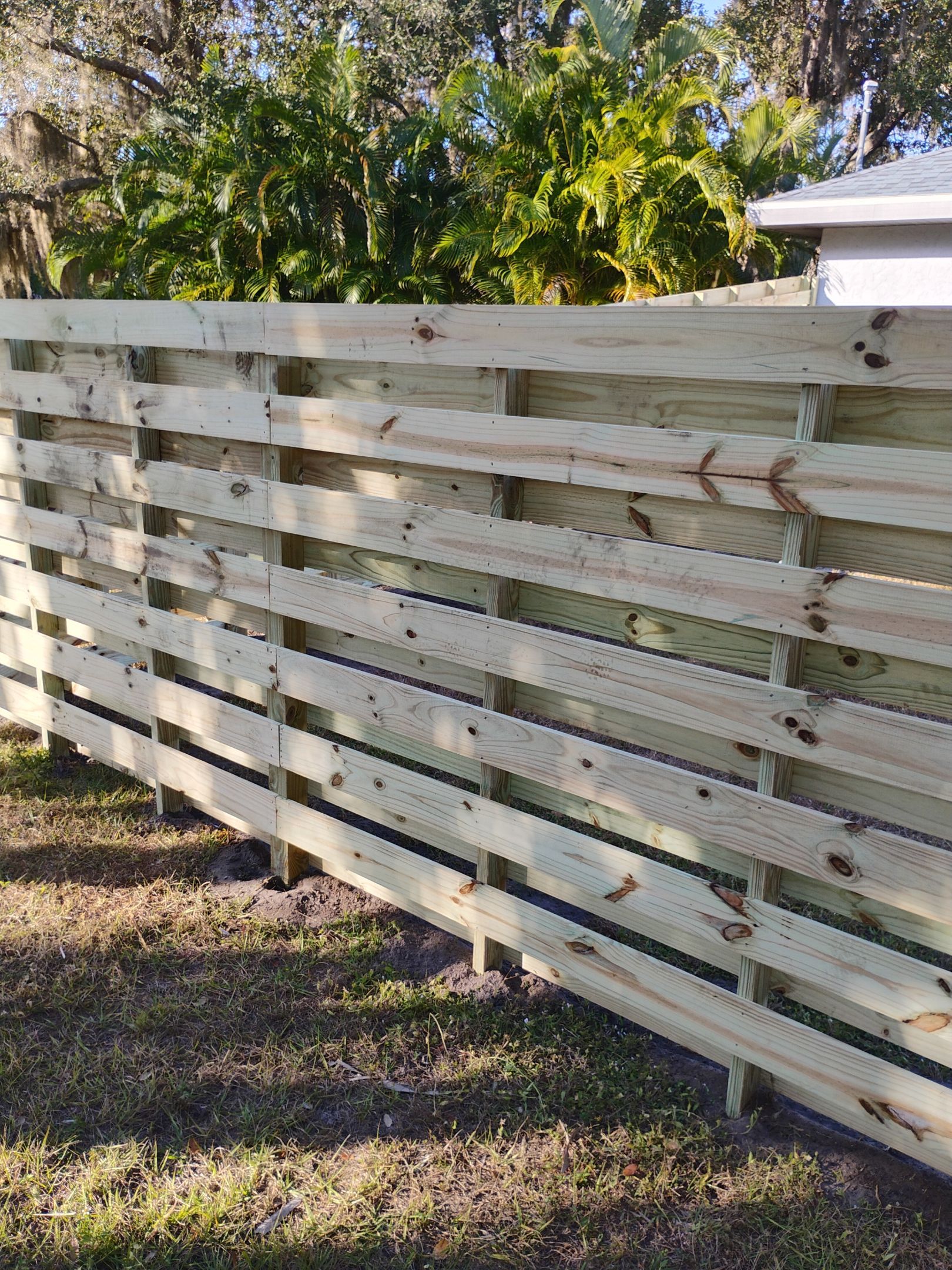 Horizontal Shadowbox Fence in Port Charlotte by True Fence LLC