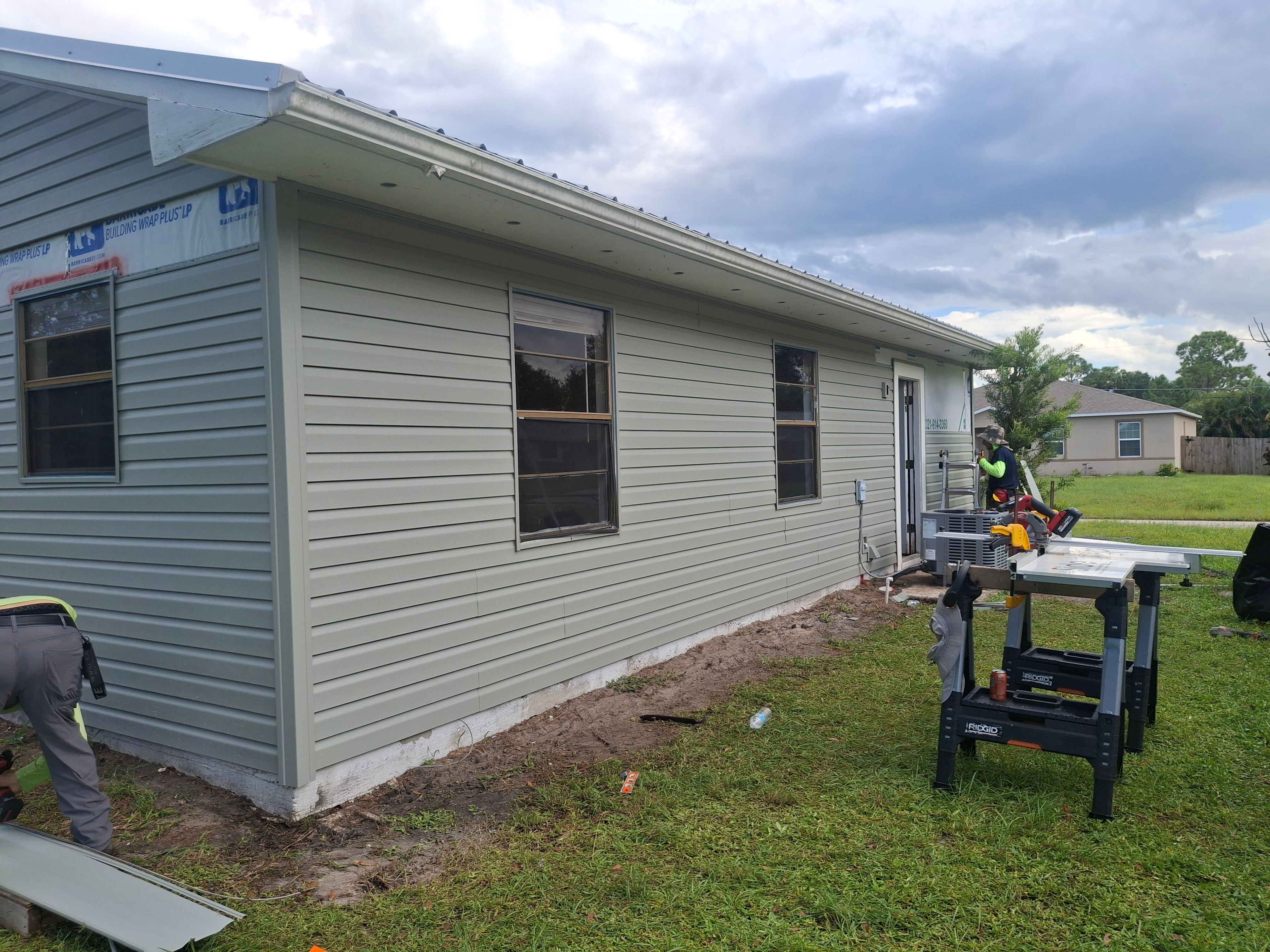Vinyl Siding Installation and Structural Wood Rot Repair in Palm Bay by Florida Roofing and Renovations Inc.