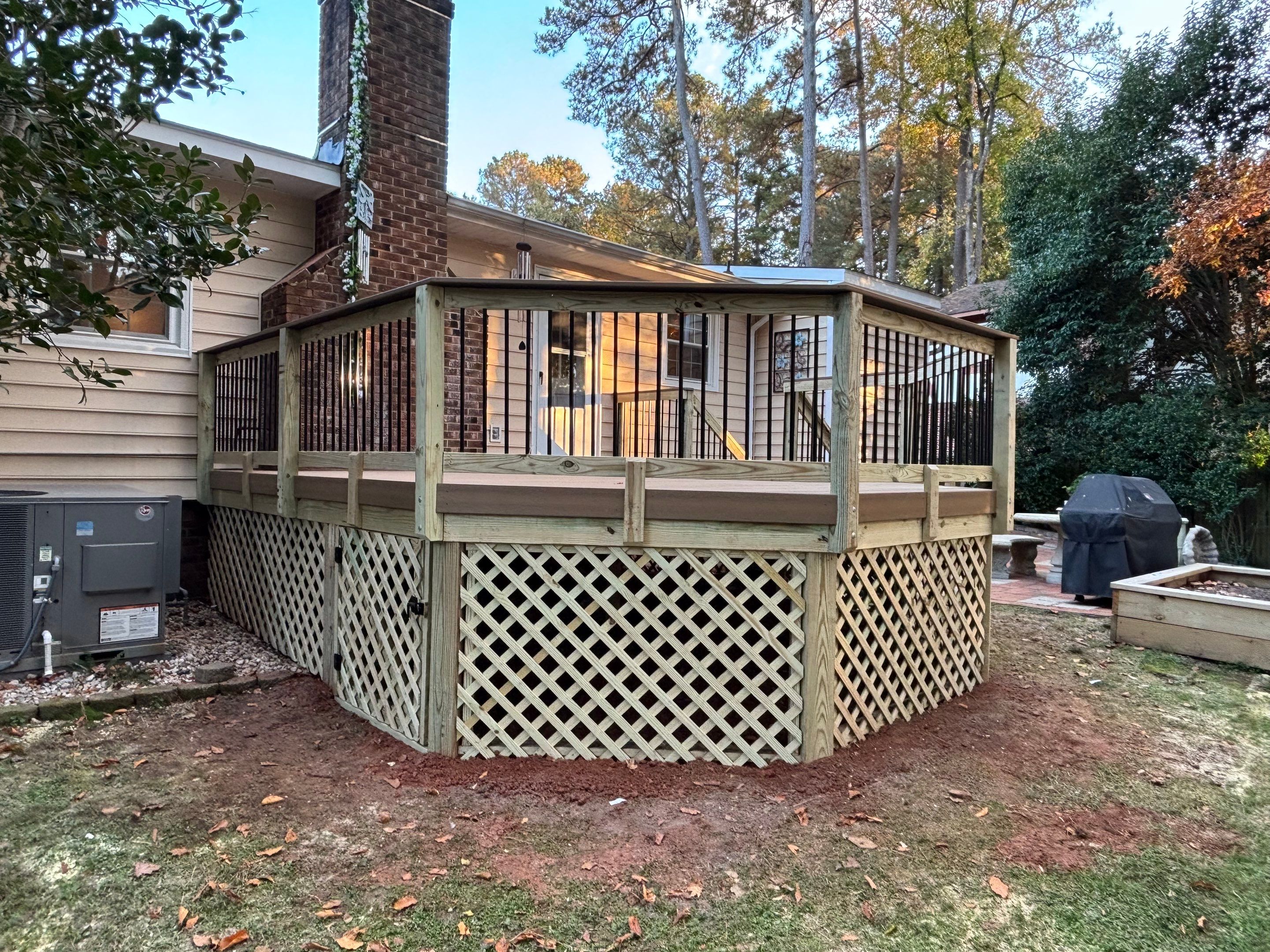 Composite Deck Resurfacing with Metal Balusters in Cary by The Remodeling Company