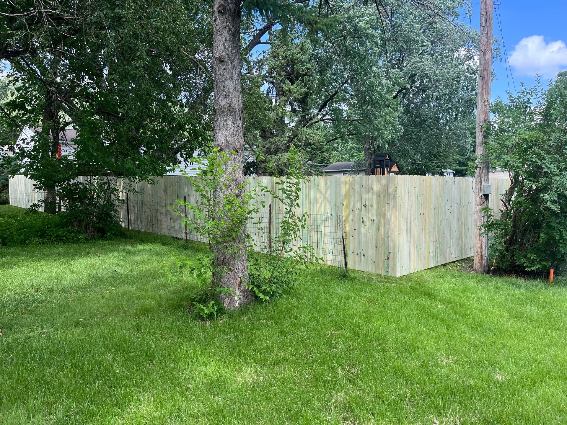 Custom Treated Pine Privacy Fence and Chain Link Installation in Cedar Falls by Perfect Picket Fence and Stain