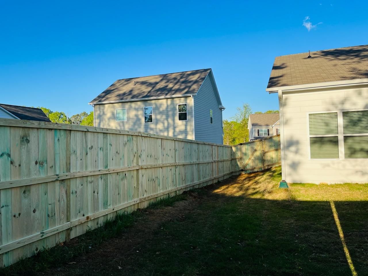Wood Privacy with Decorative Top Cap by Titans of Timber Fence & Stain