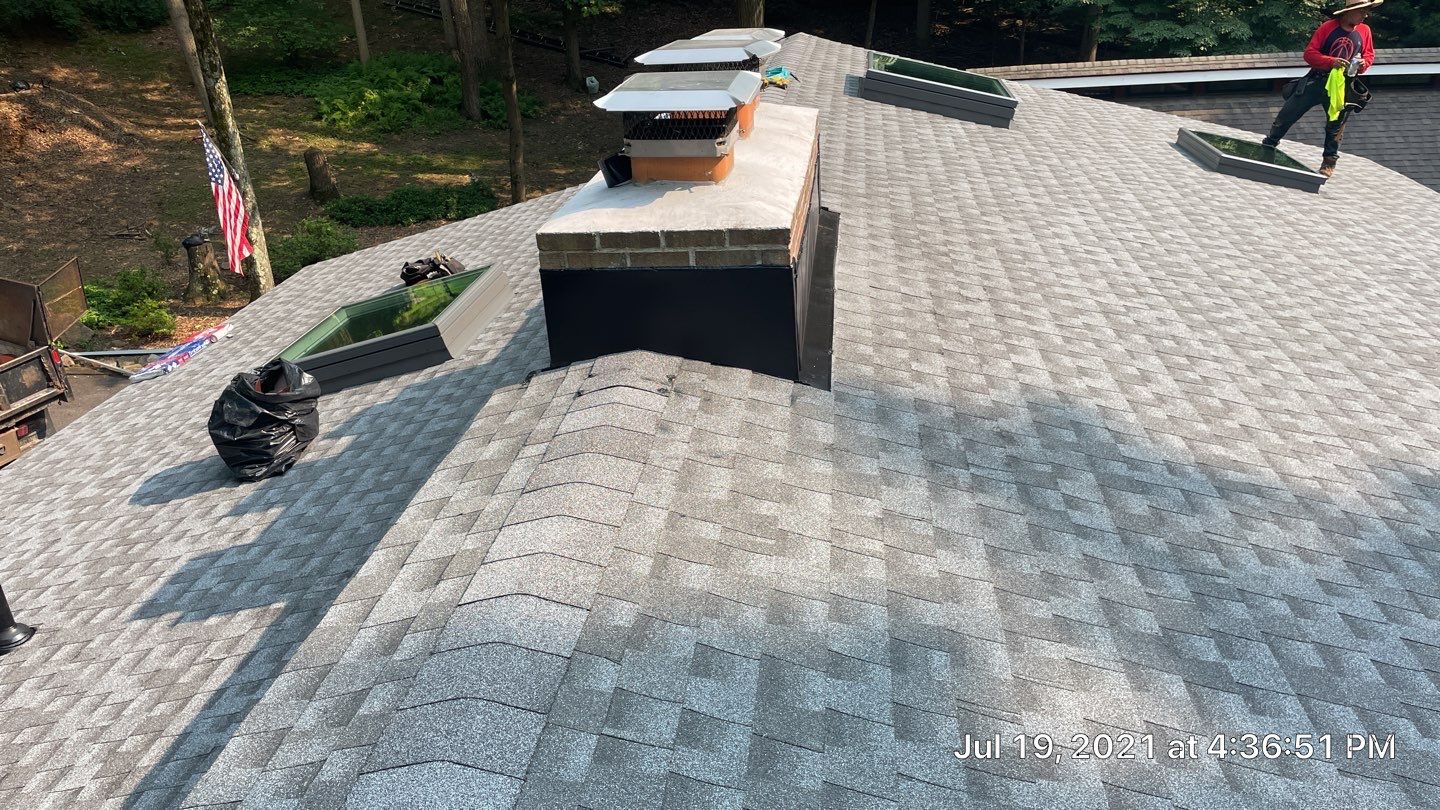 Deckhouse Roof Replacement by American Home Contractors