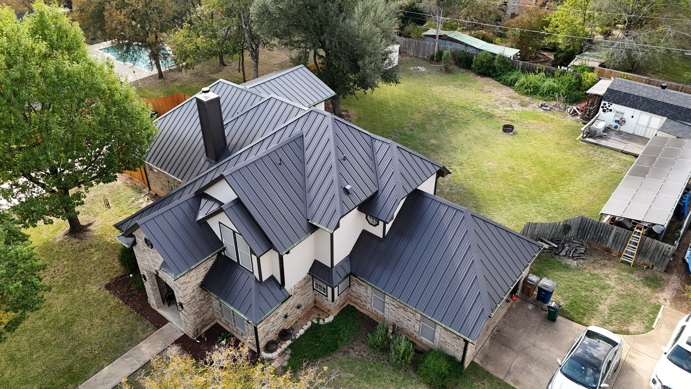 Residential Roof Replacement using 24 GA Double-Lock - Matte Black by Action Exteriors Austin