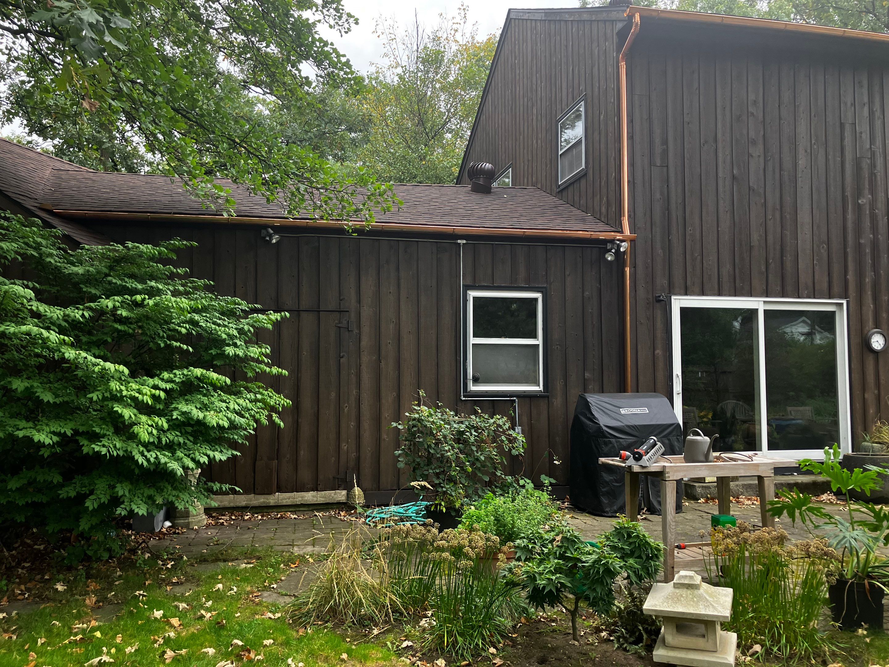 Asphalt Roof Replacement with Half Round Copper Gutter Installment  by Custom Installations, Inc.