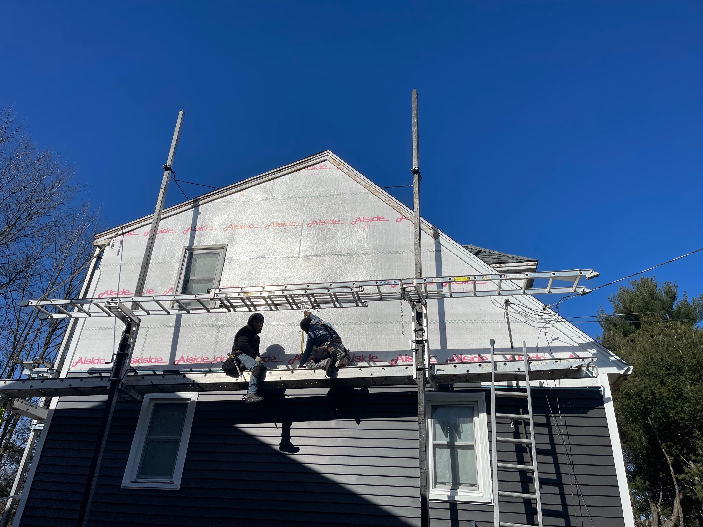 Complete Exterior Renovation with New Siding & Gutters   by Sensible Home Solutions