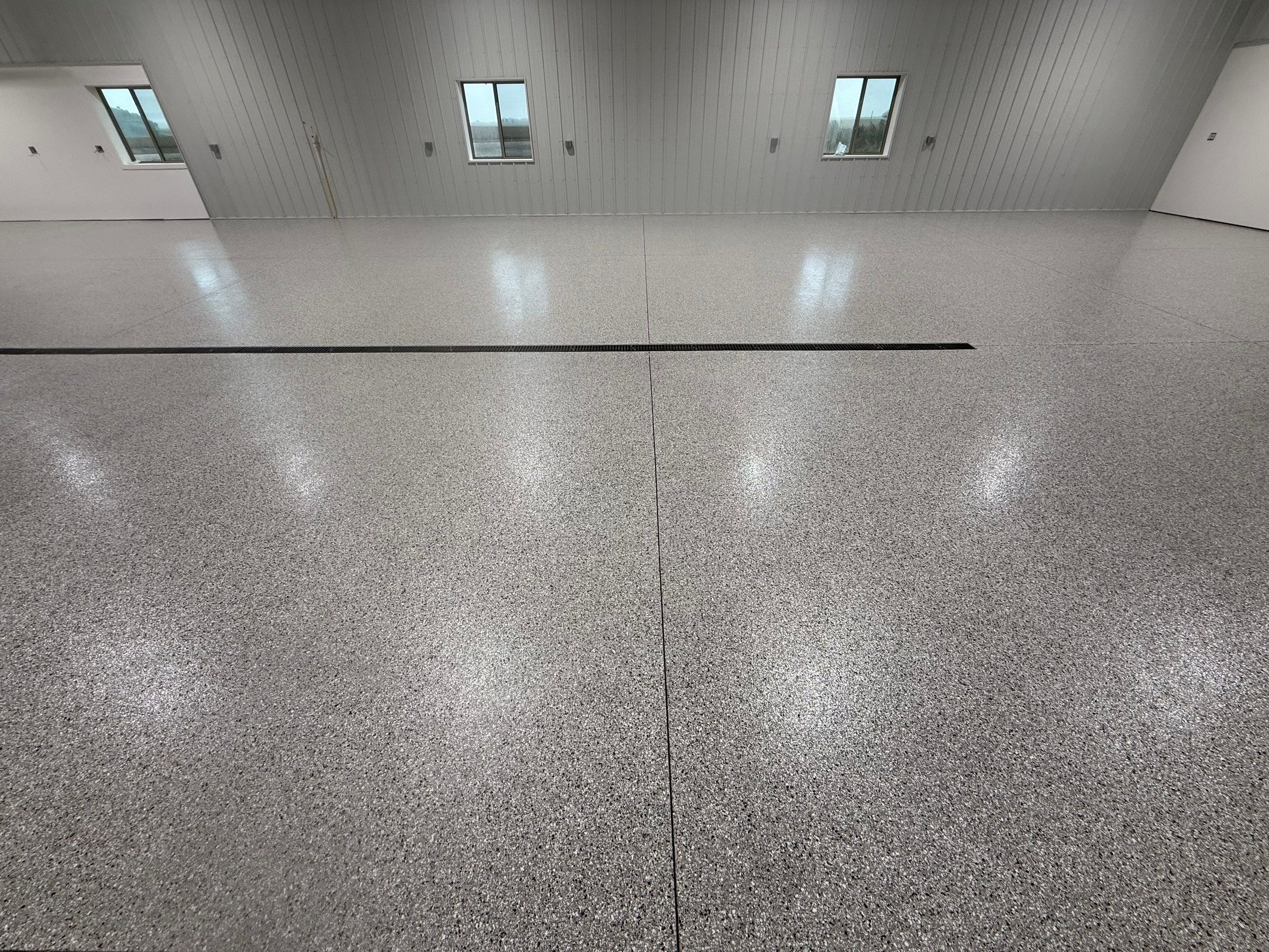 Custom Speckled Floor Coating for Large Montrose Shop by Select Painting, Coatings & Garage Cabinets
