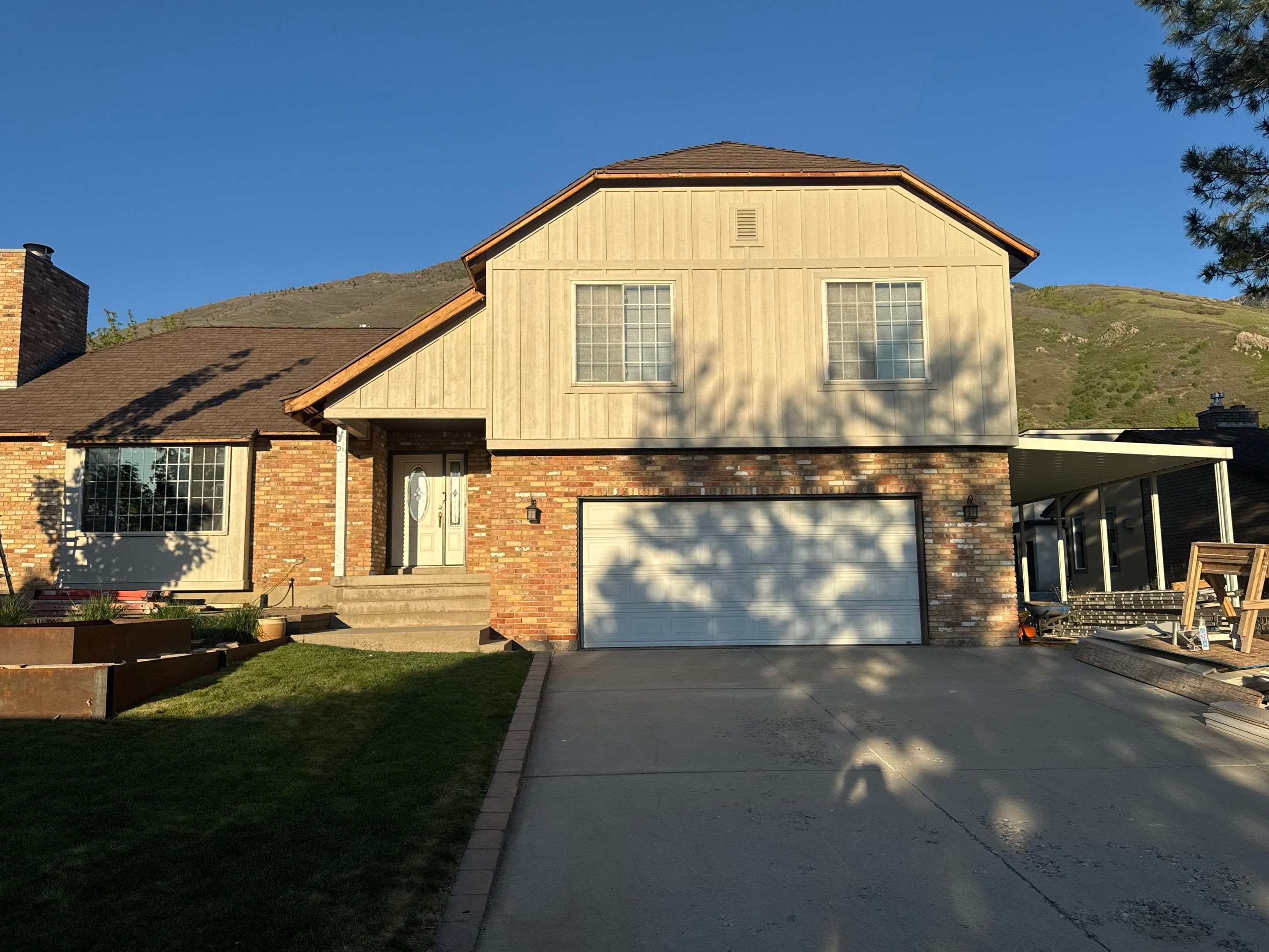 Cottonwood Heights | Custom Hardie Exterior & Bold Fascia | Cobble Stone Accents by Ideal Siding Utah