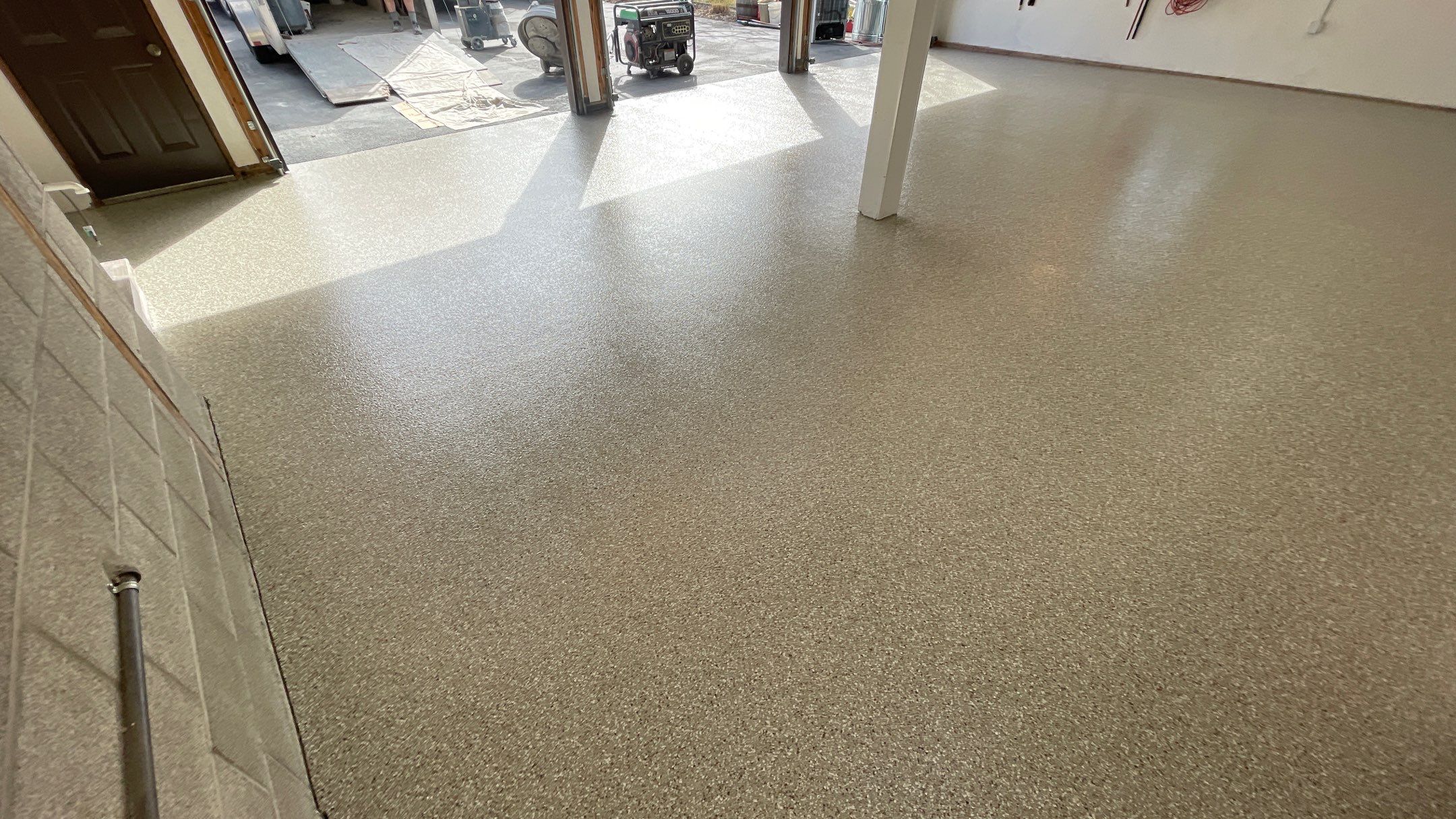 Garage Floor Polyaspartic Coating with Pebble Beach 1/4" Flakes by Croc Coatings, LLC