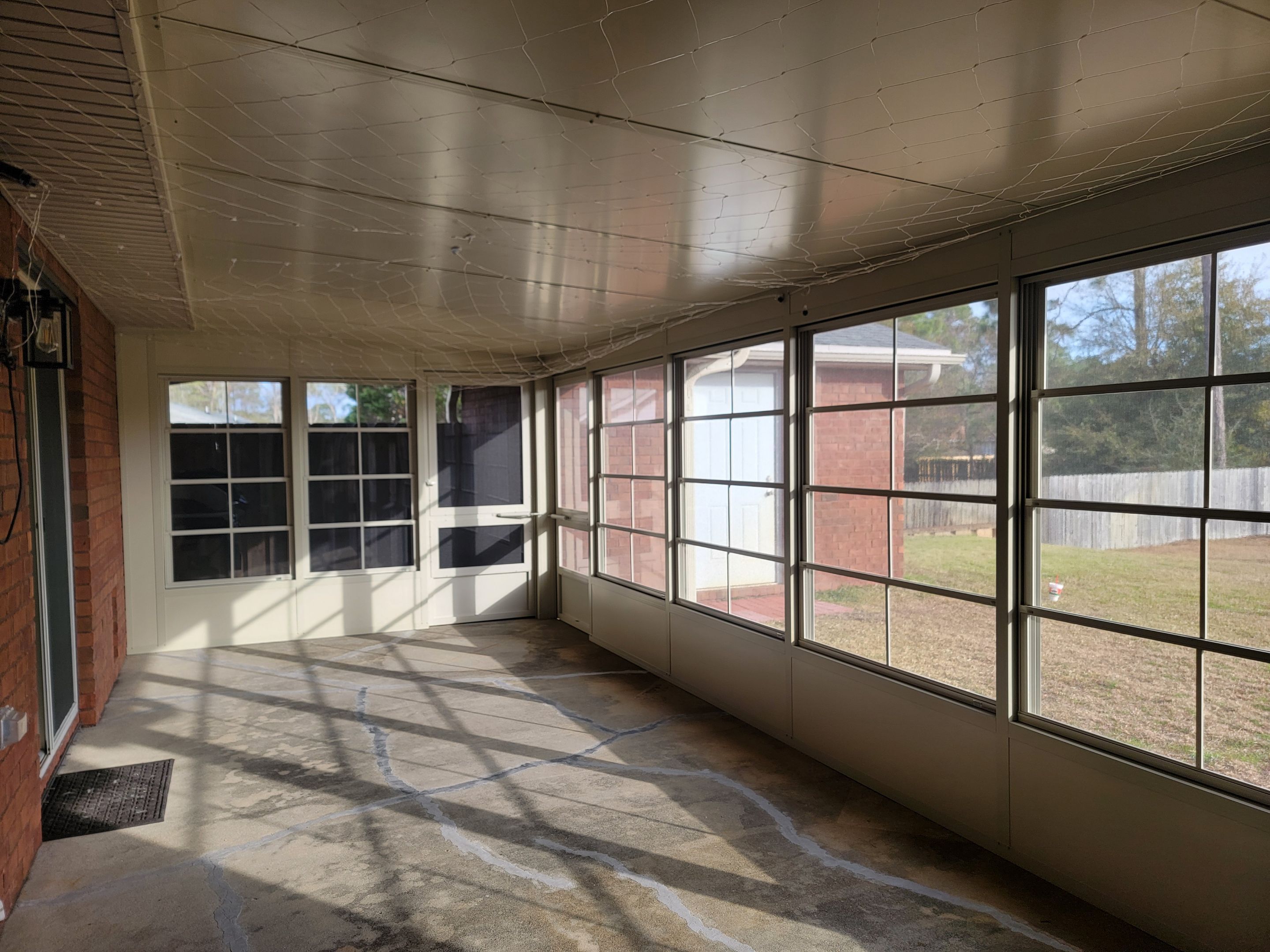 Enclosure w/Vinyl Windows using Colorbeam by Titan Sunrooms