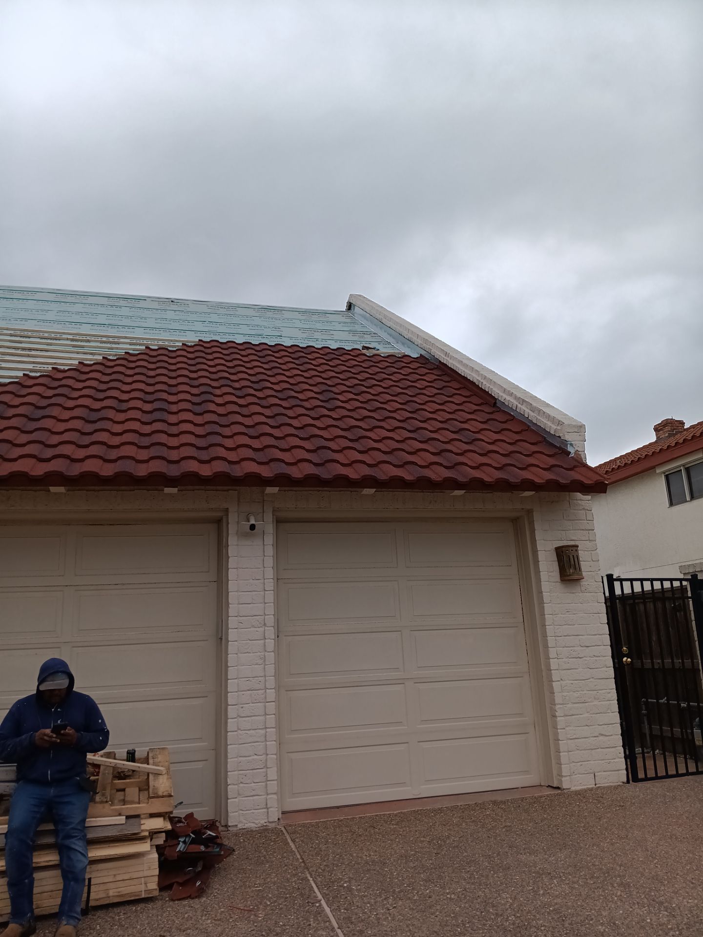 Off with the Tile and on with the TILCOR stone coated metal.  by Bayfront Roofing and Construction