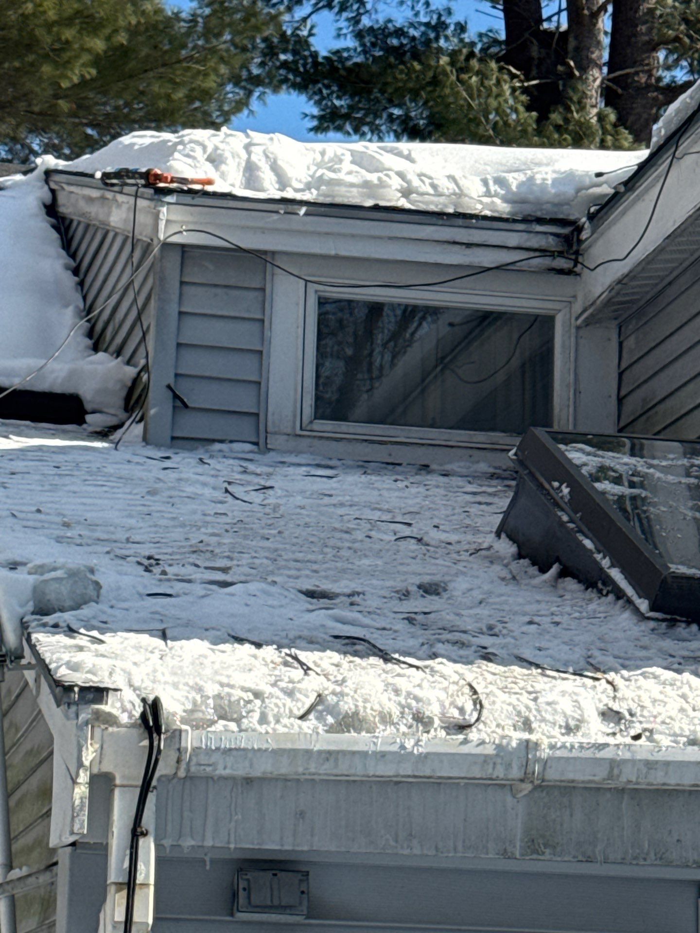 Ice Dam Removal, Snow Removal & Sidewall Flashing Repair in Acton, MA  by Mighty Dog Roofing of Greater Middlesex County
