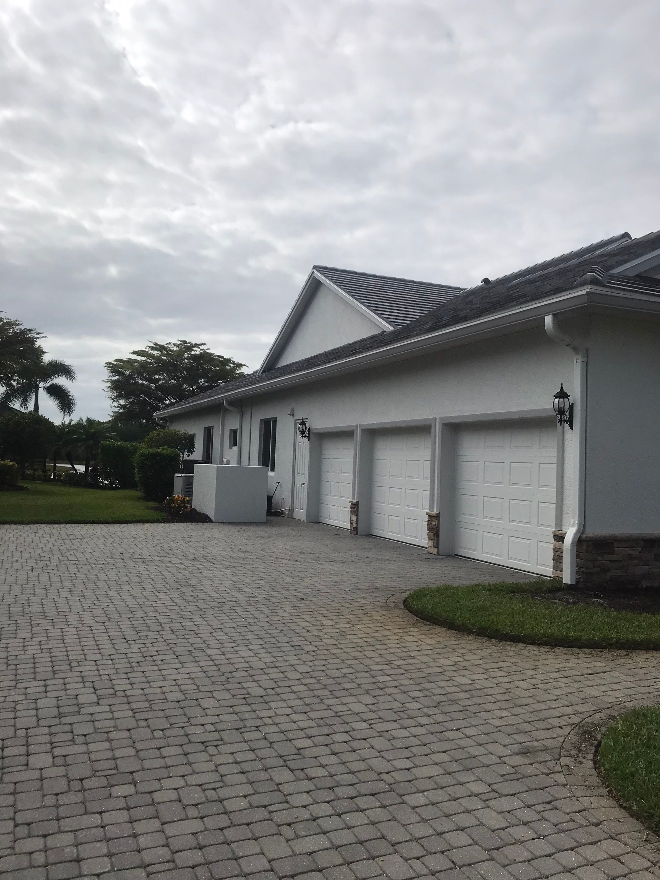 7-inch Grey Gutter Installation and White Downspouts in Fort Myers FL  by Gutter Professors