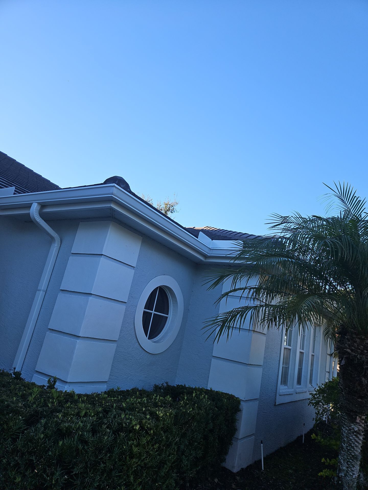 White Down Spouts using downspouts and White Seamless Gutters in Sarasota FL by Gutter Professors