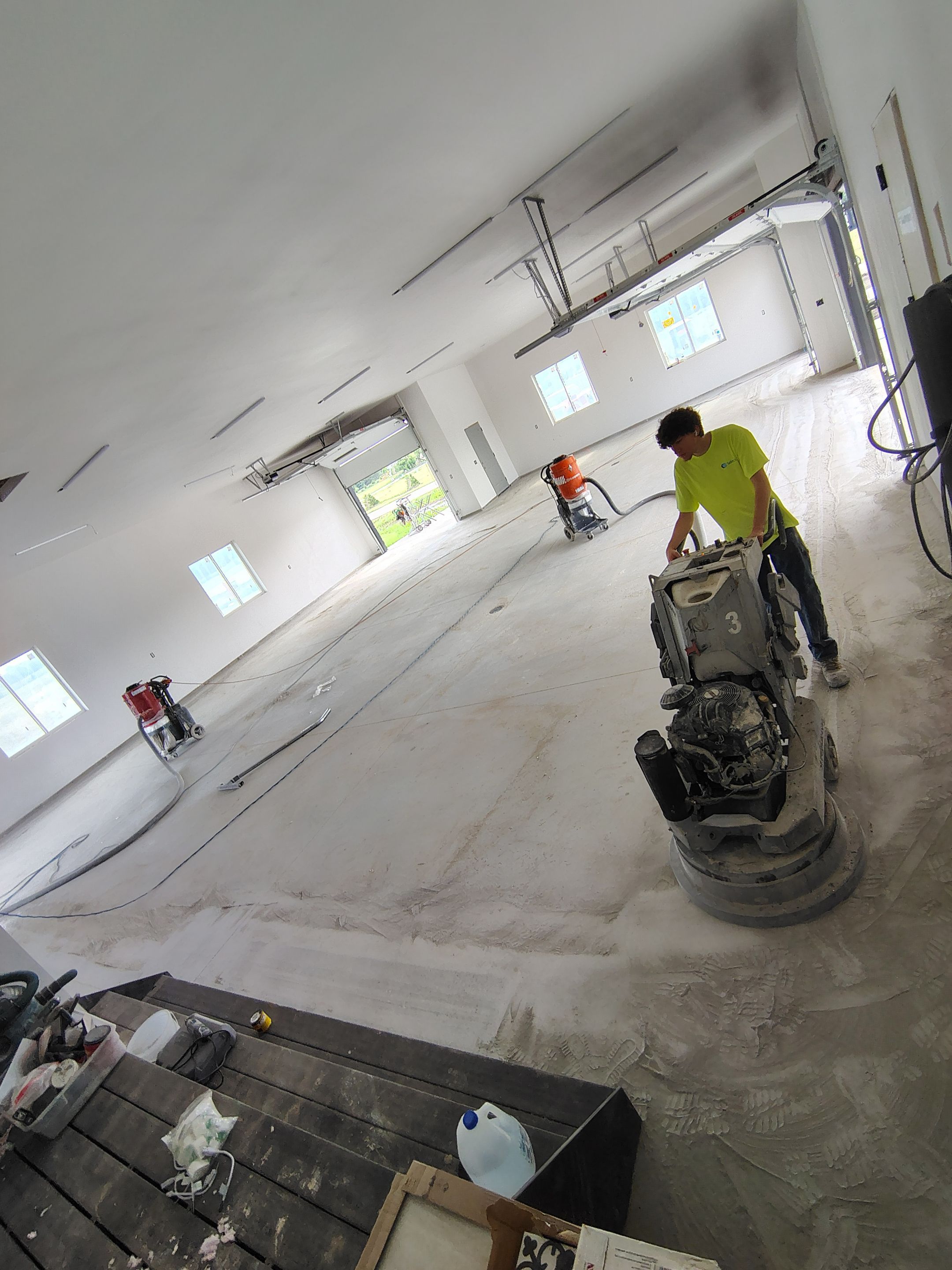 Multi-Bay Garage Concrete Coating and Floor Refinishing in South Dakota by Select Painting, Coatings & Garage Cabinets