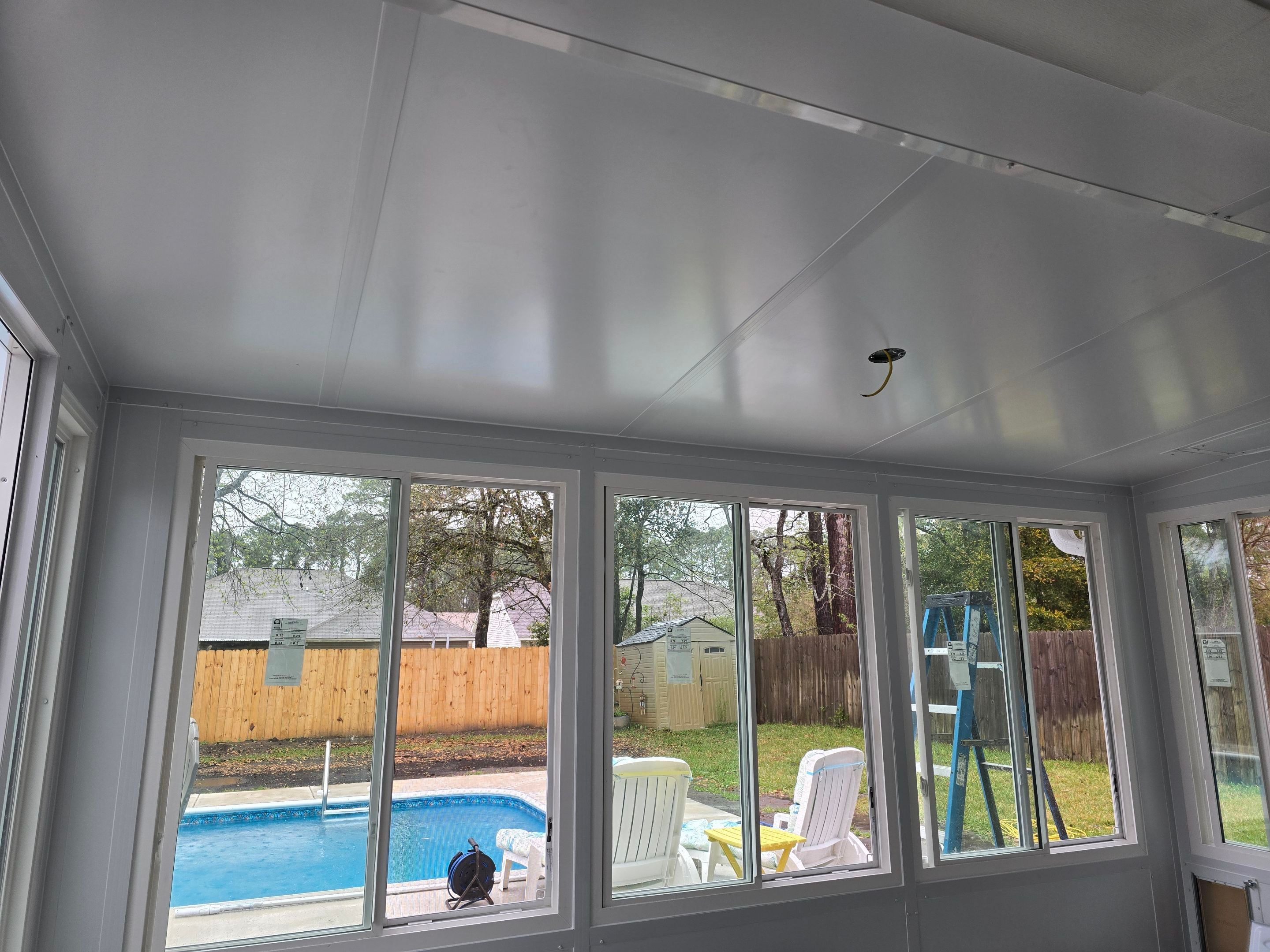 Poolside Glass Room in Gulf Breeze by Titan Sunrooms