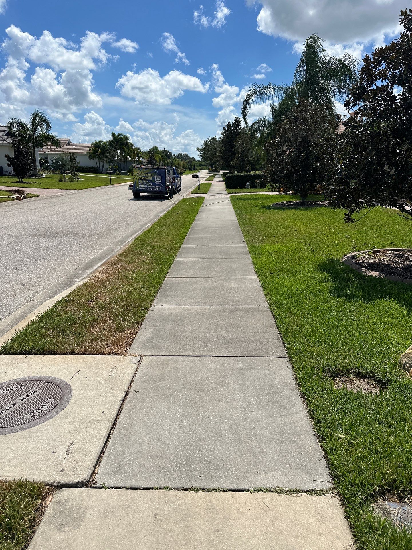 Paver Driveway, Entryway, Sidewalk, and Street Curbing Cleaning in Winding River Community, Bradenton, FL by Sunshine AquaWash
